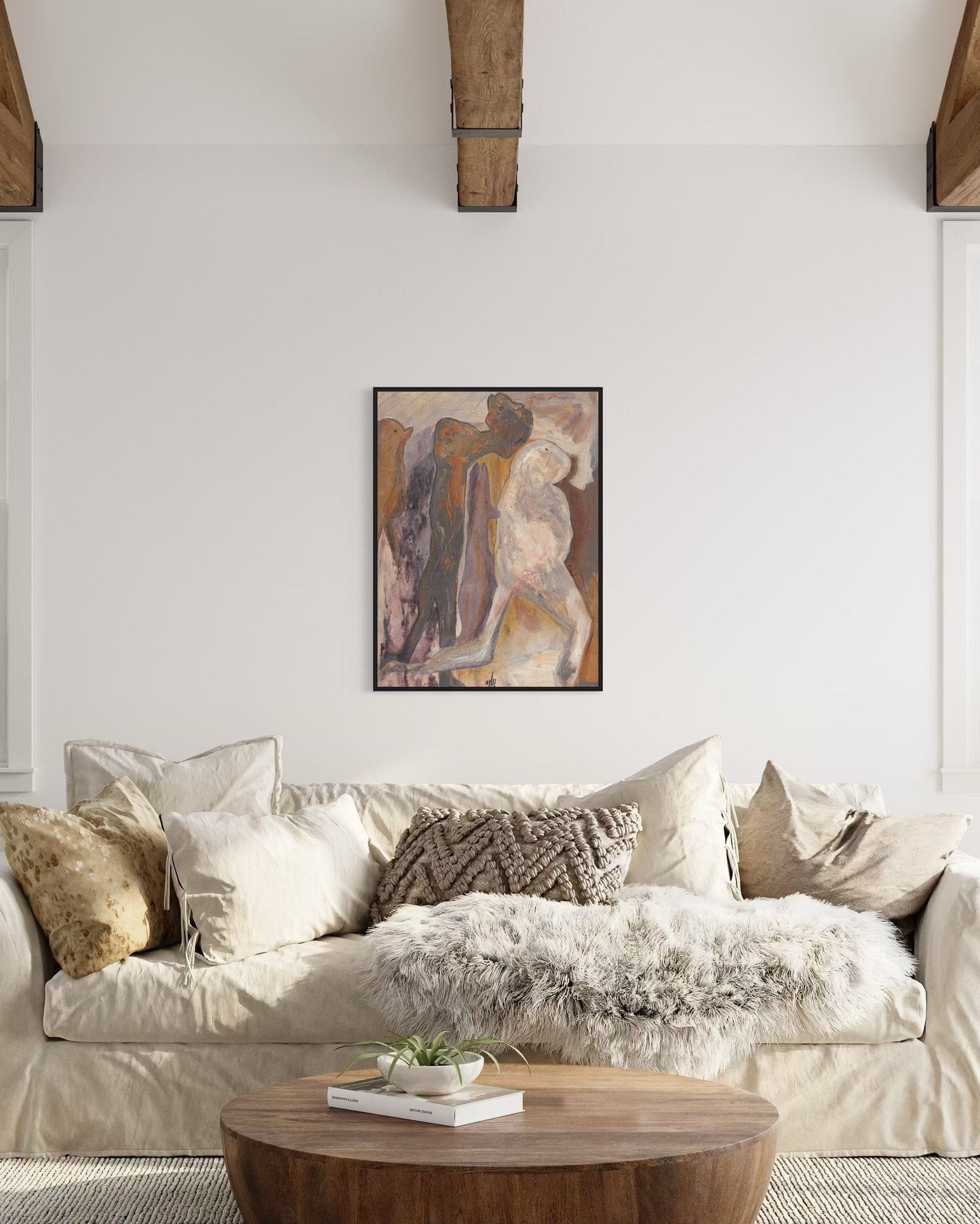 Living room with a beige sofa, wooden coffee table, and abstract art on the wall.