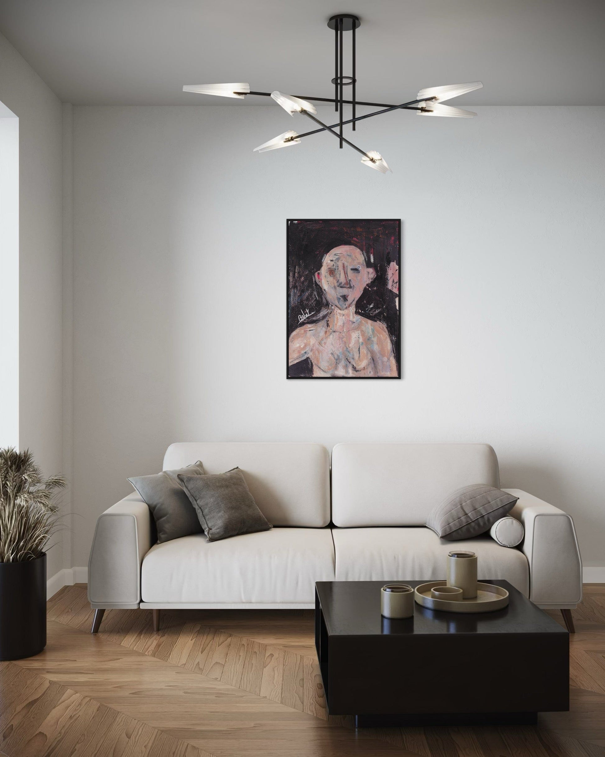 Modern living room with a white sofa, black coffee table, and abstract painting on the wall.