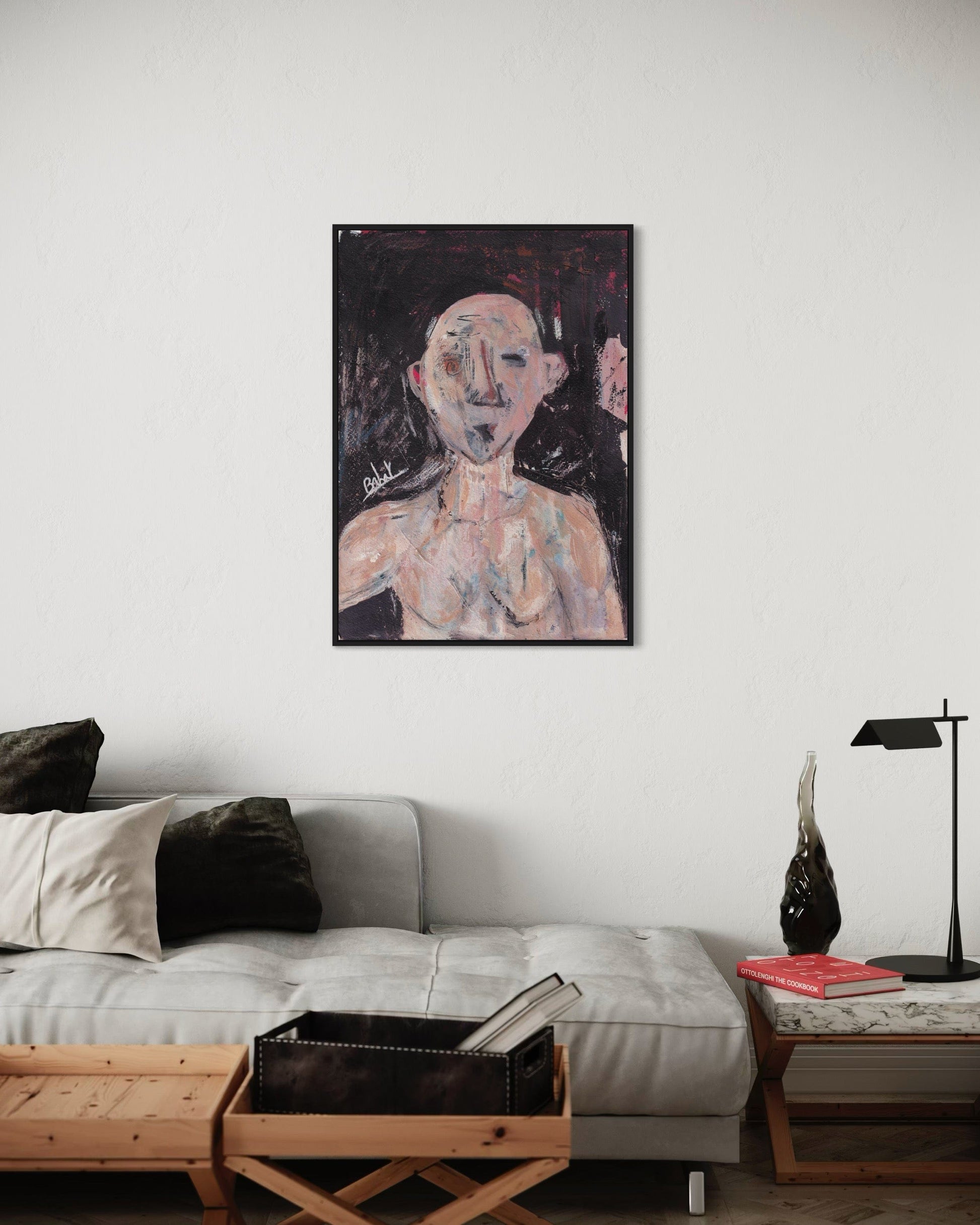 Living room with a gray sofa, wooden coffee table, and a painting of a nude figure on the wall.