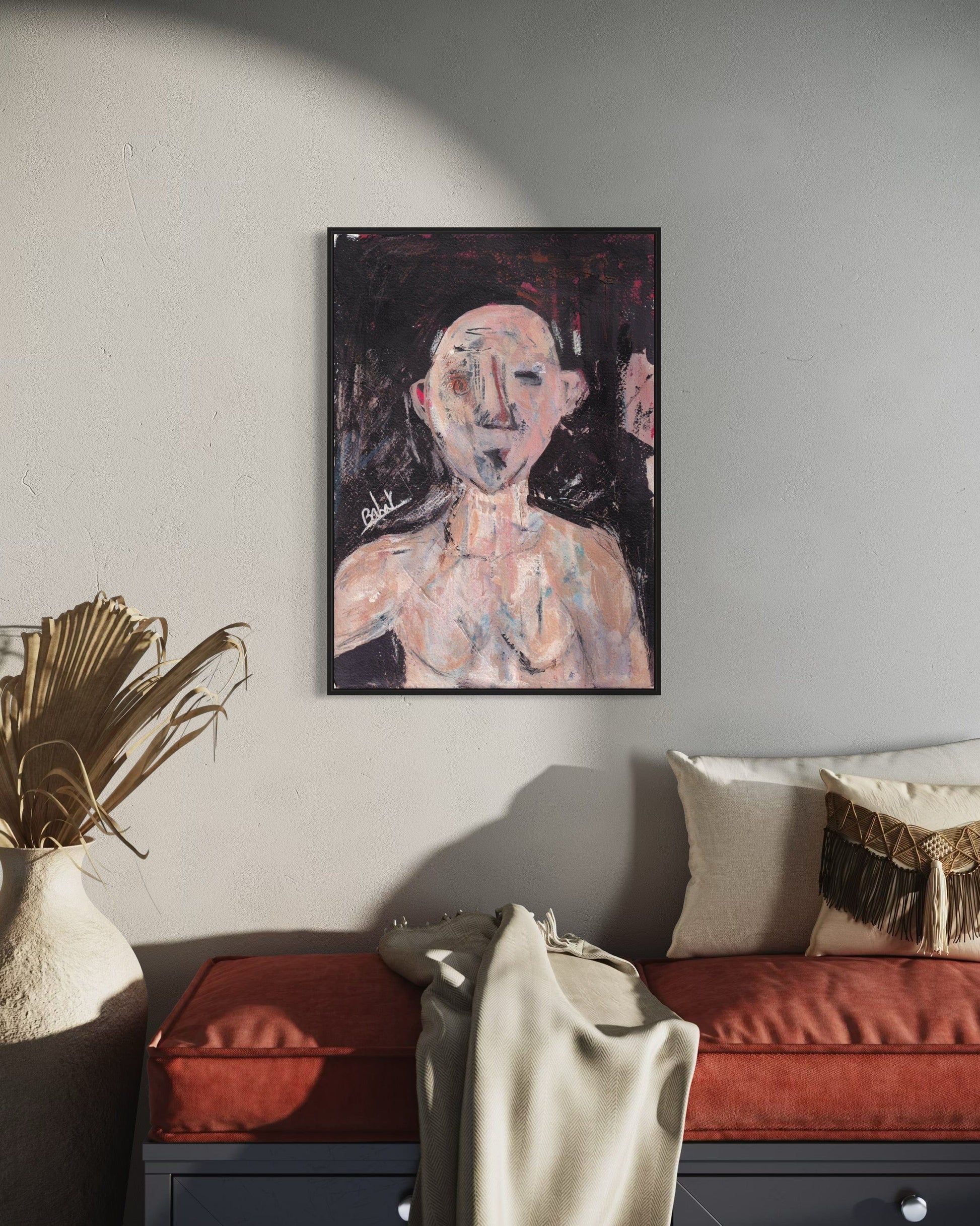 Abstract painting on a wall above a sofa in a living room