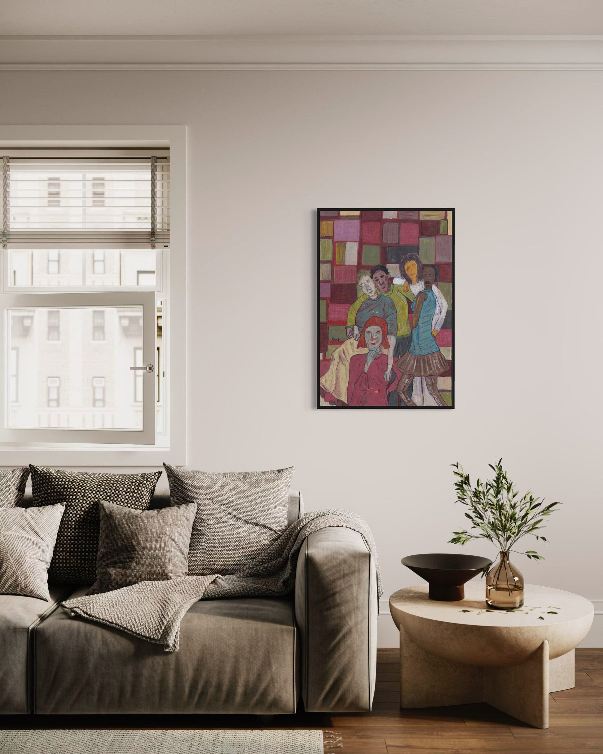 Living room with a gray sofa, colorful abstract painting, and small table with decorative items.
