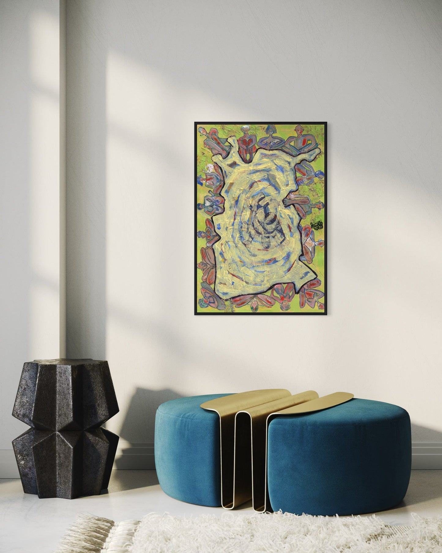 Colorful abstract painting on a wall above a blue and gold ottoman in a room.