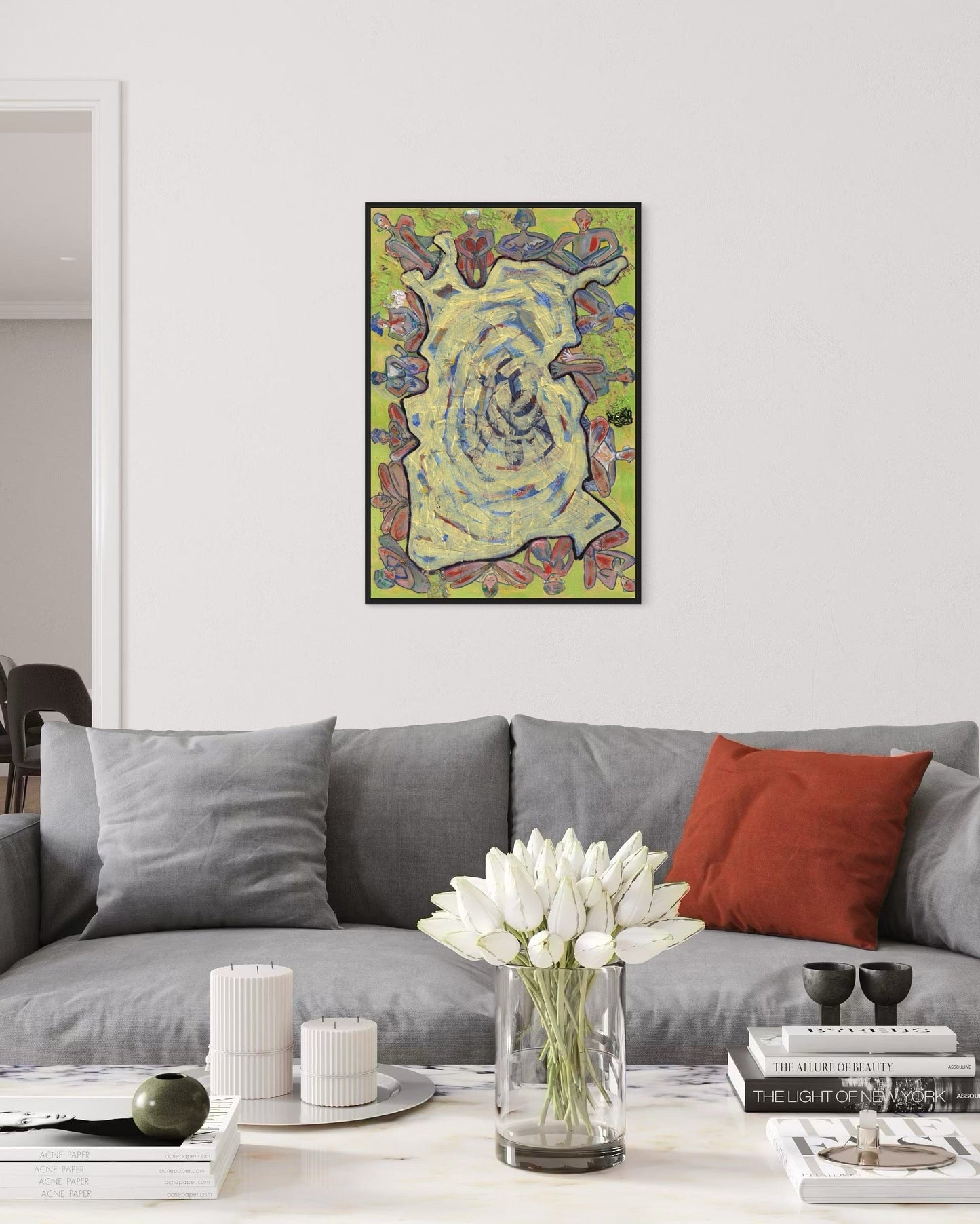 Living room with a gray sofa, red pillow, and a colorful abstract painting on the wall.