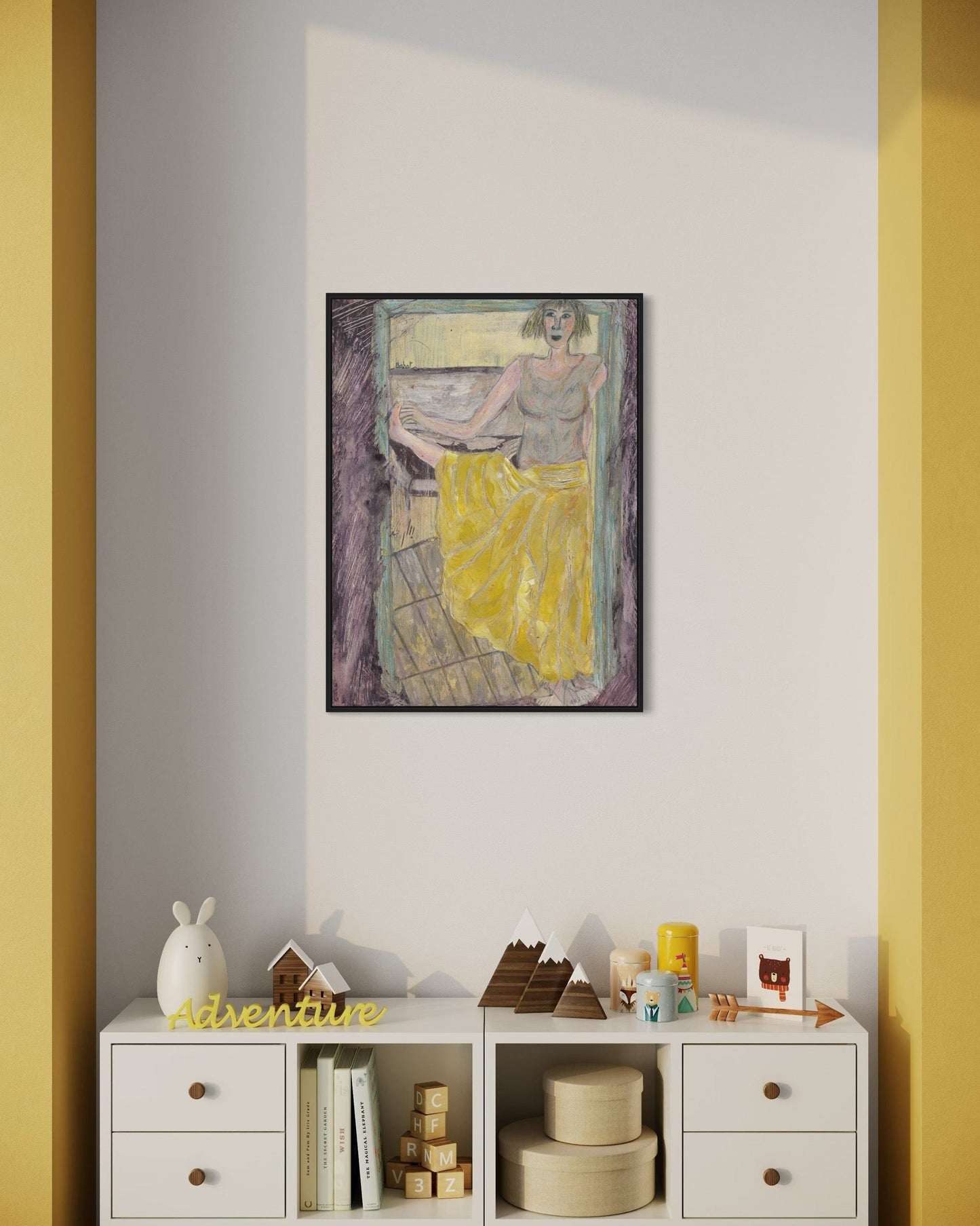 Framed artwork on a wall with a shelf below containing decorative items.