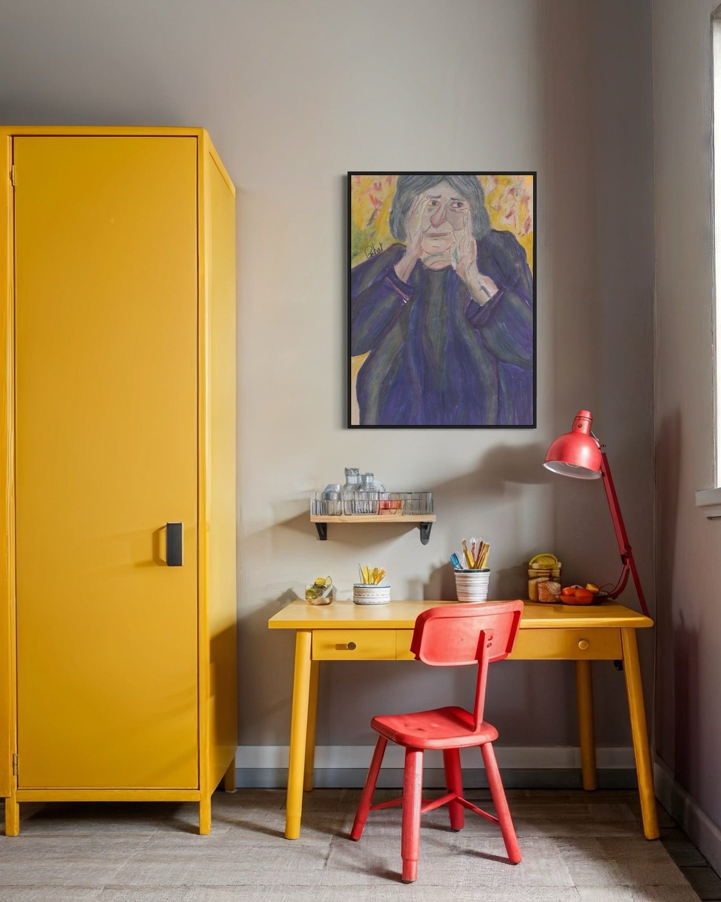 Yellow cabinet, red chair, and desk with a painting on the wall in a room.