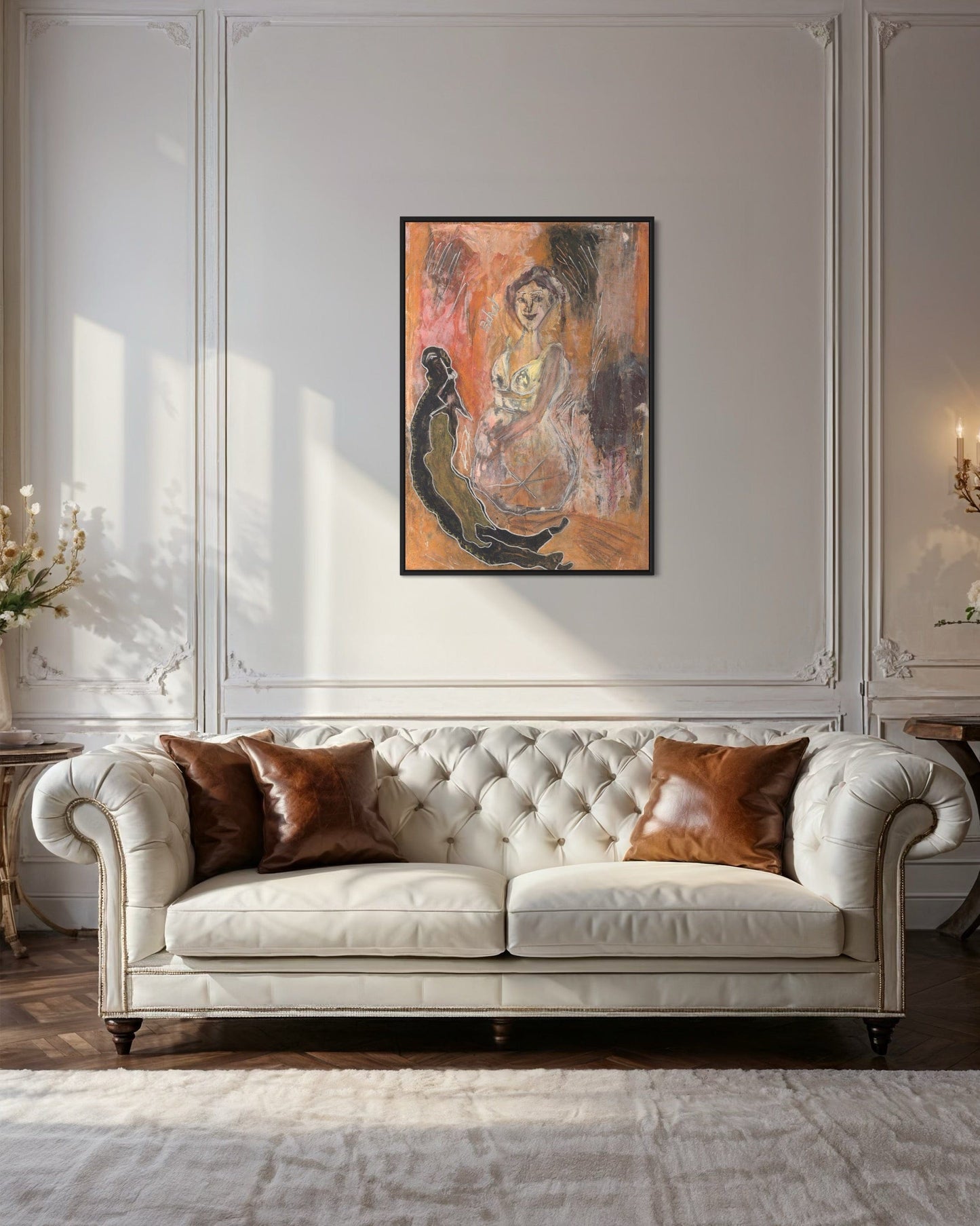 White tufted sofa with brown cushions in a room with a painting on the wall.