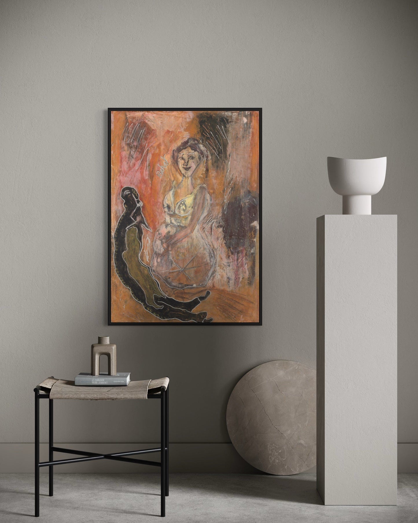 Abstract painting on a wall with a side table and decorative items in a minimalistic room.