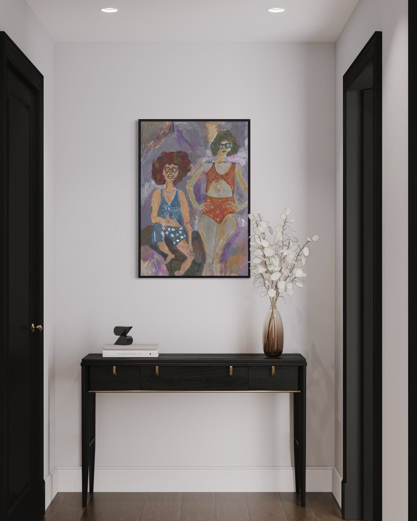 Modern interior with a black console table, vase with white flowers, and colorful abstract painting on a white wall.