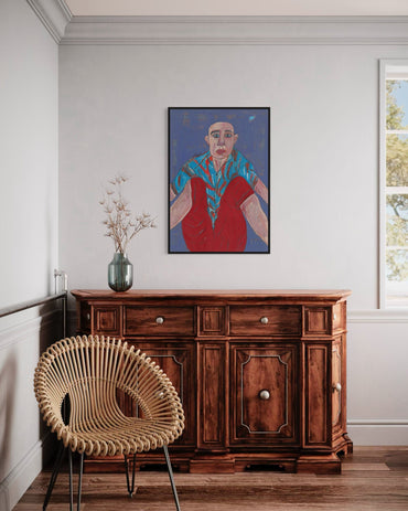 Wooden sideboard with a wicker chair and a colorful painting on a white wall.