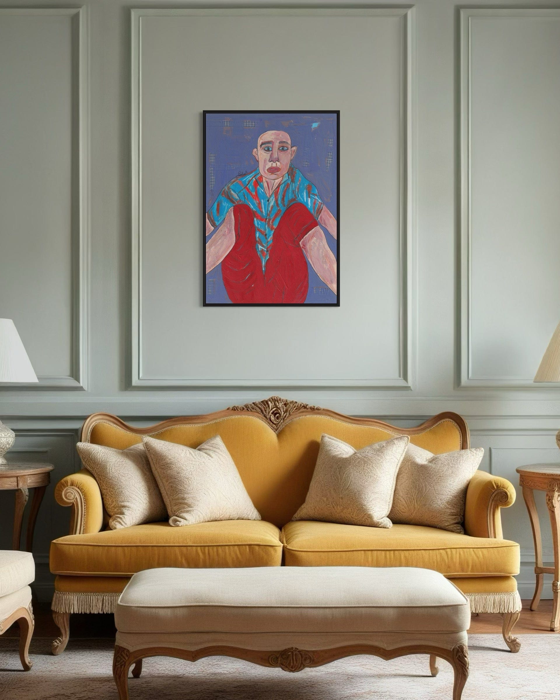Yellow sofa with decorative pillows in a room with a framed painting on the wall.