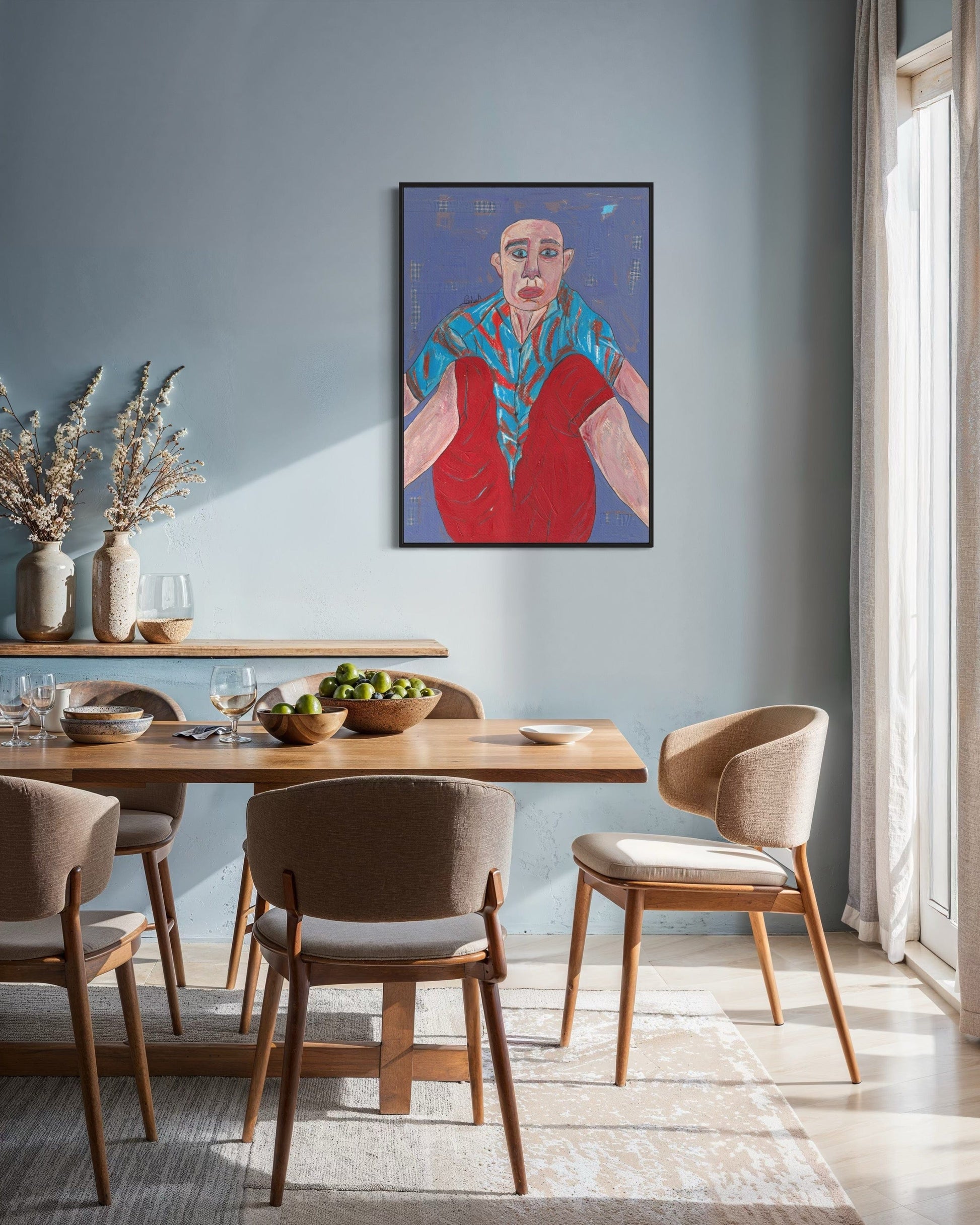 Dining room with a wooden table and chairs, and a colorful painting on the wall.