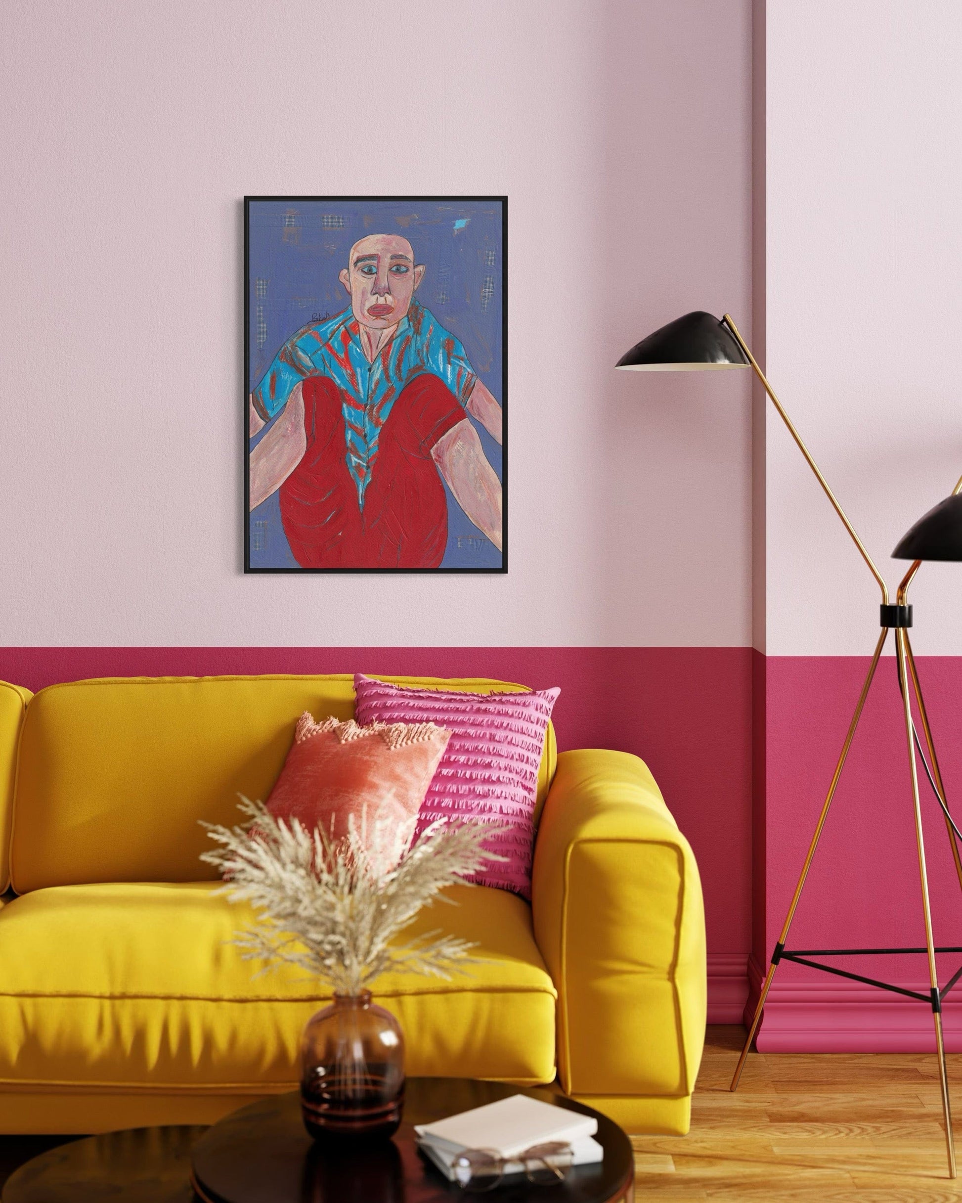 Living room with a yellow sofa, pink wall, and colorful artwork.