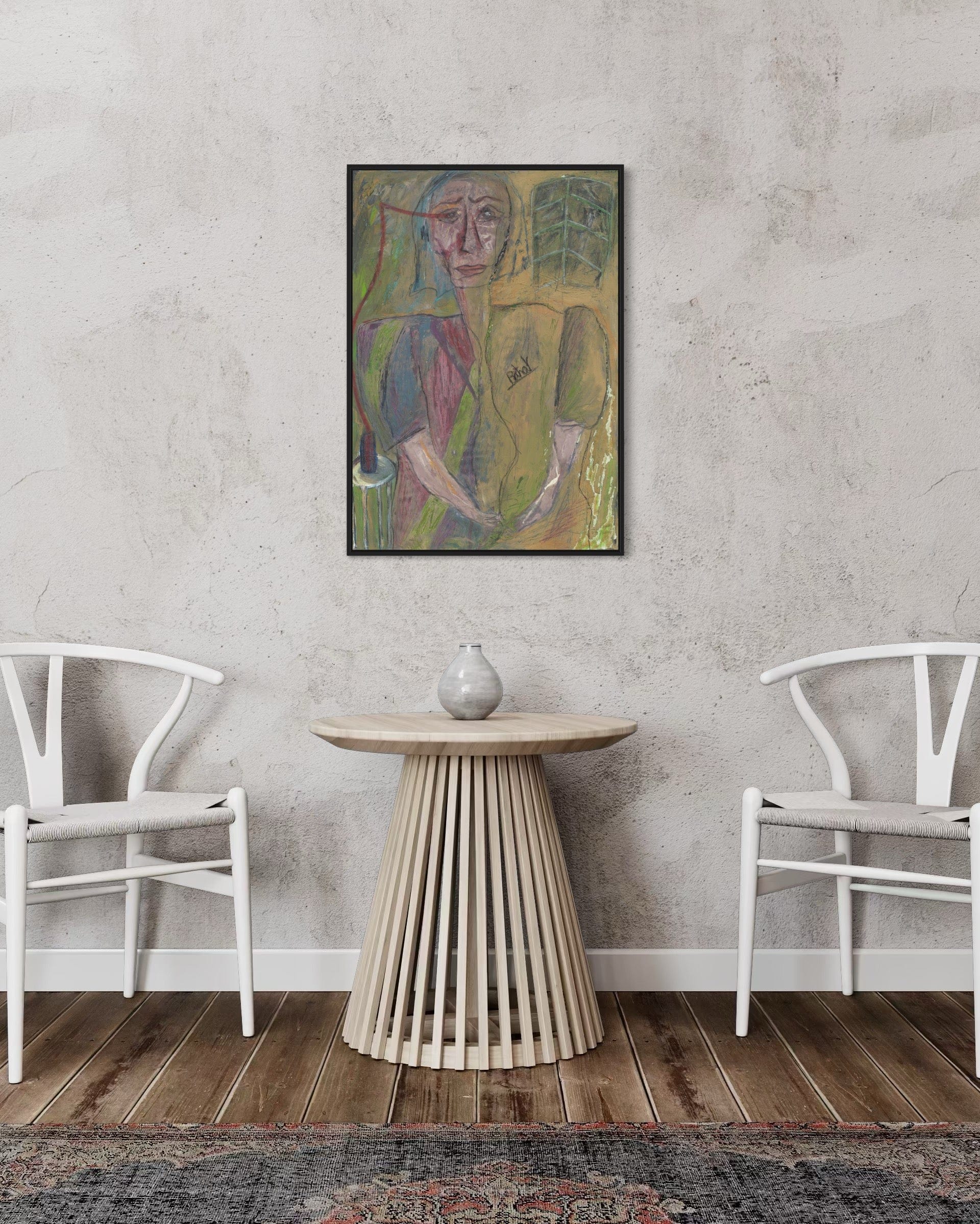 Framed abstract painting on a wall above a wooden side table with two white chairs.