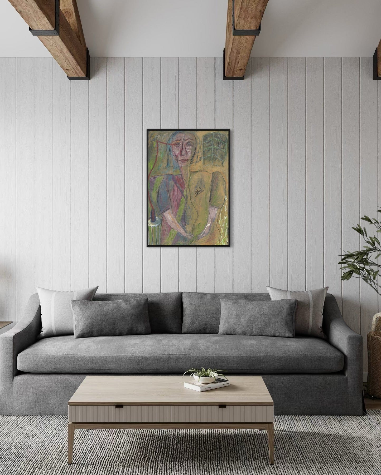 Living room with a gray sofa, wooden coffee table, and abstract painting on the wall.