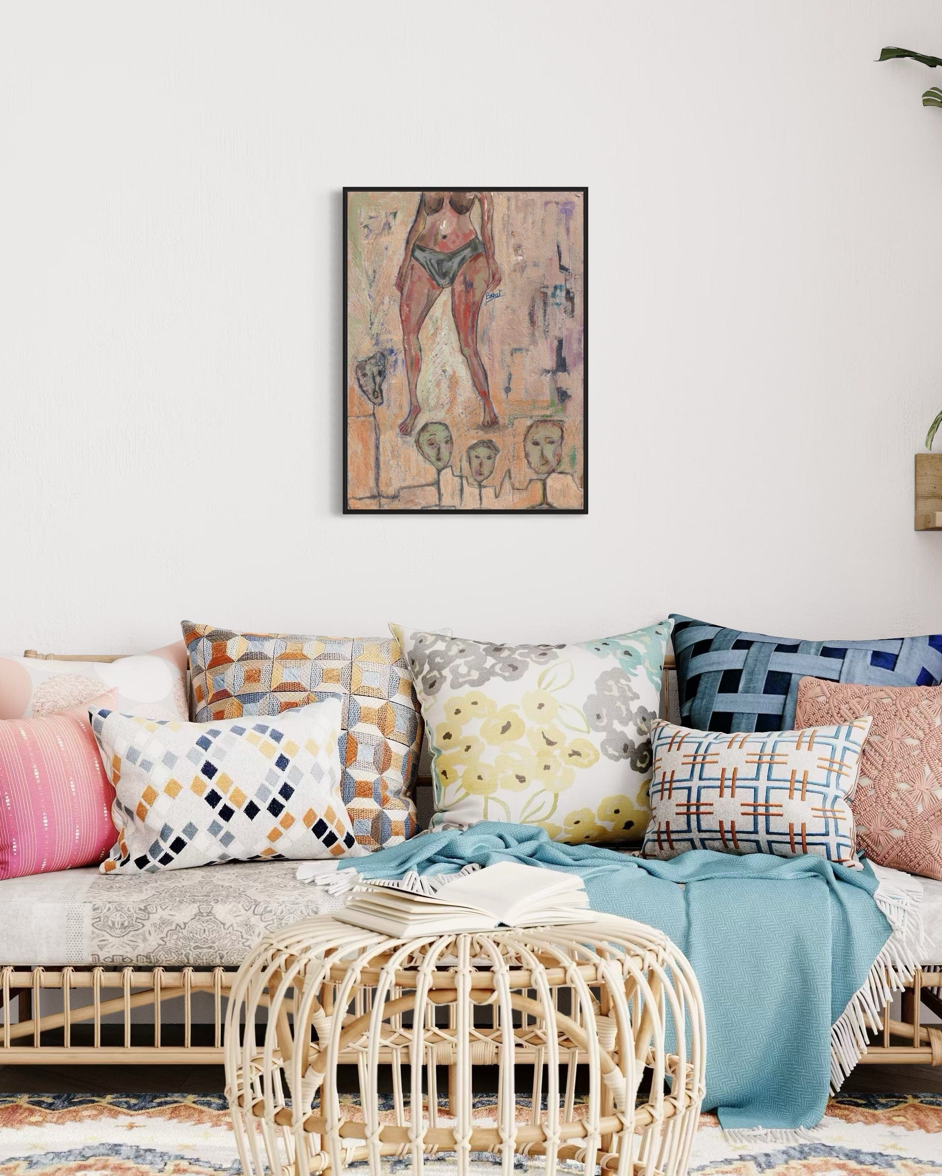 Living room with a sofa adorned with colorful pillows and a framed artwork on the wall.