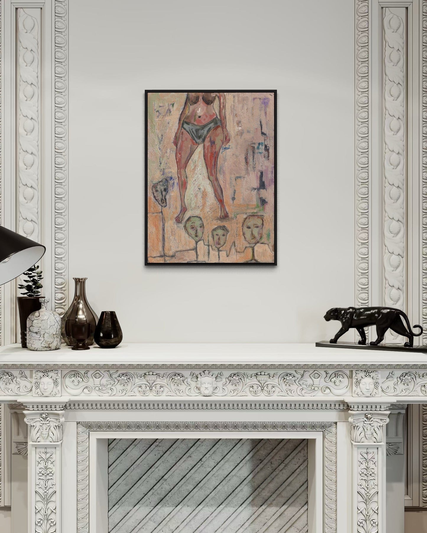 Framed artwork on a wall above a decorative fireplace mantle.