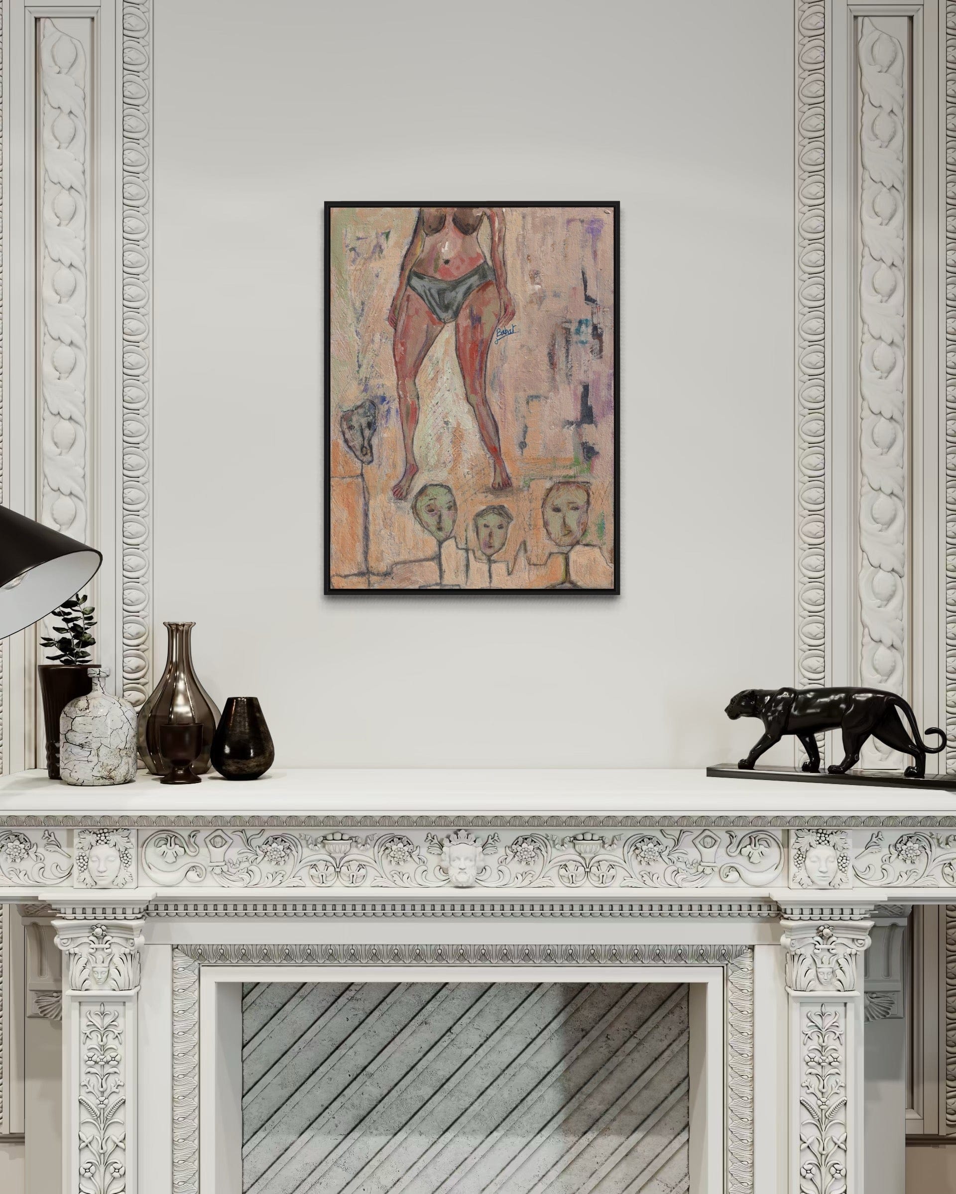 Framed artwork on a wall above a decorative fireplace mantle.