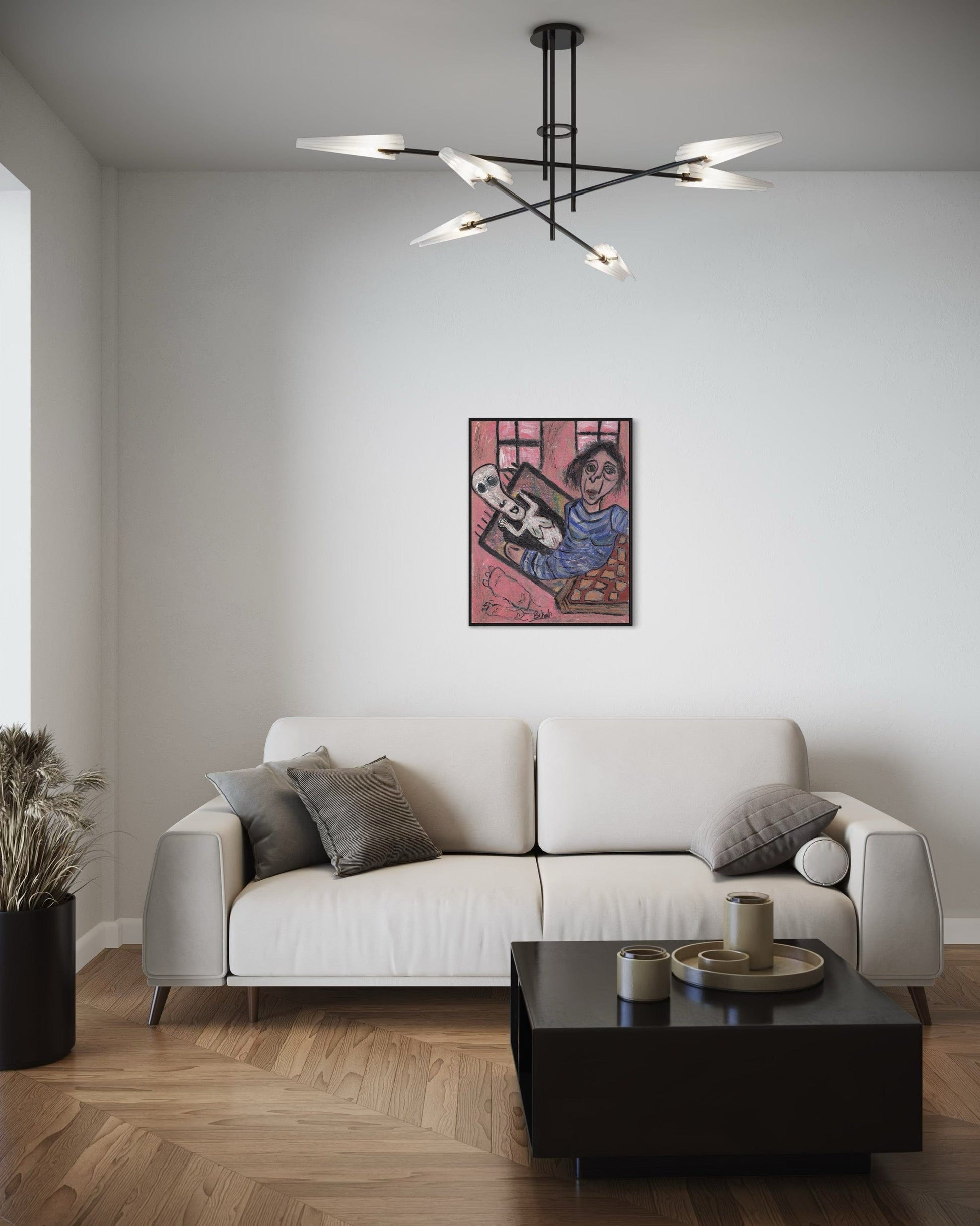 Modern living room with a white sofa, black coffee table, and abstract painting on the wall.