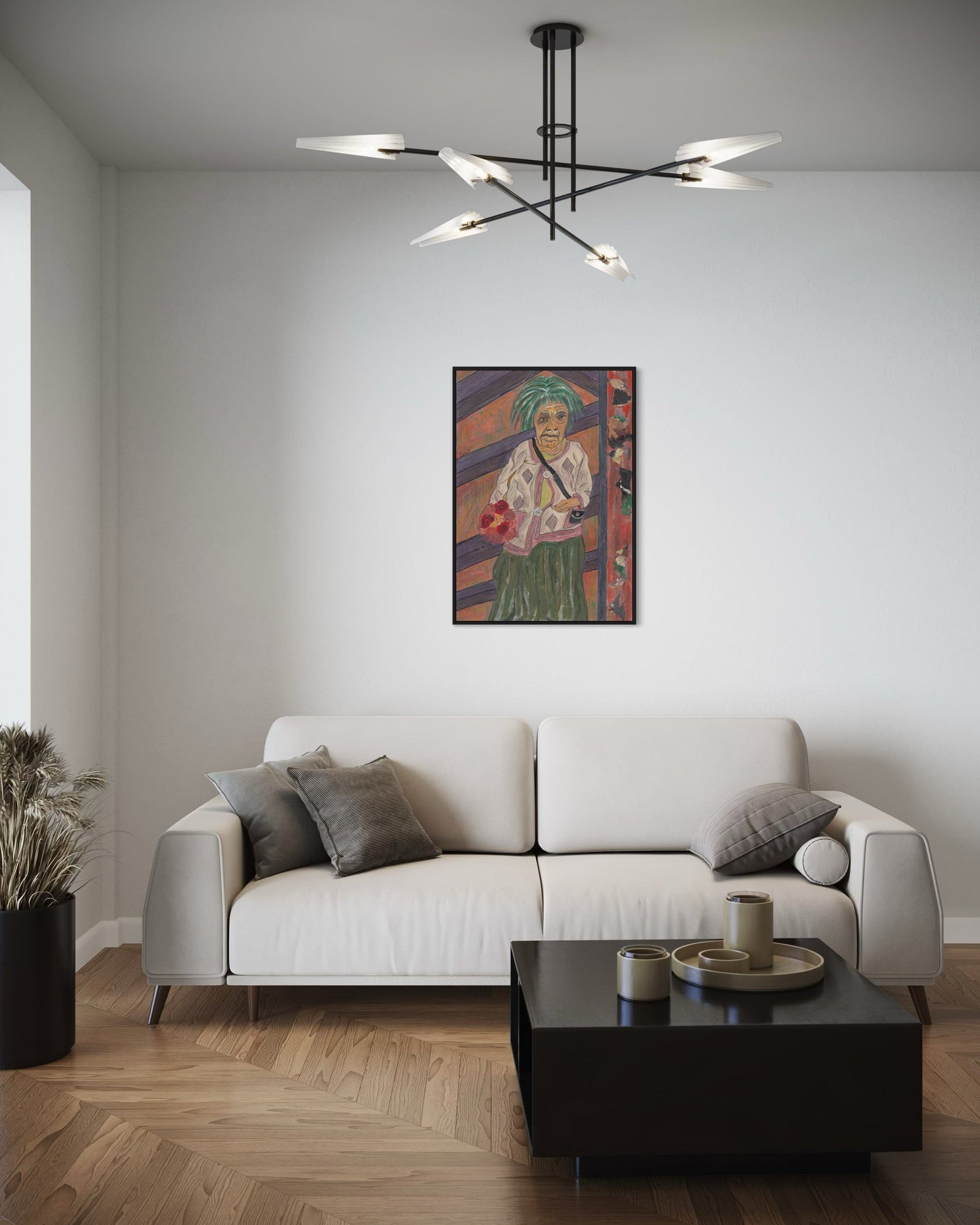 Modern living room with a white sofa, coffee table, and colorful painting on the wall.