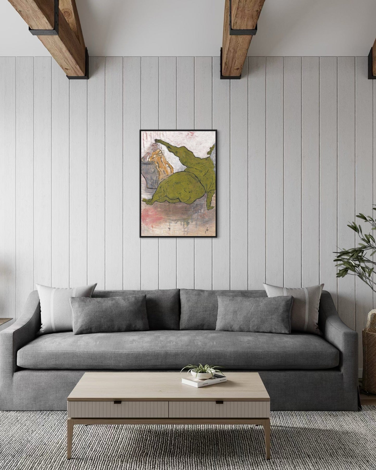 Gray sofa in a living room with a coffee table and decorative elements.
