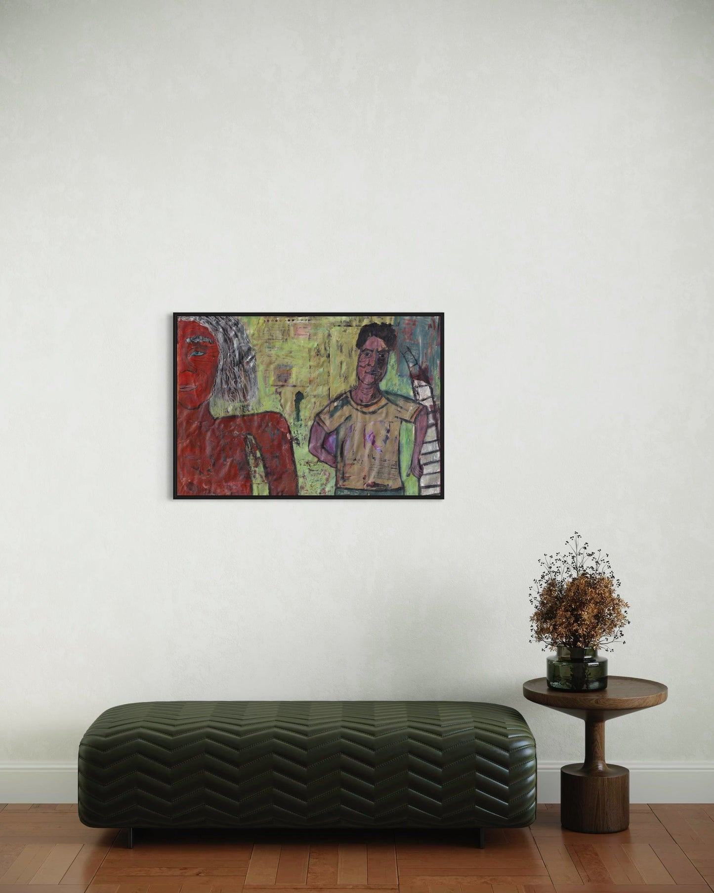 Colorful abstract painting on a white wall above a black bench and small round table with a plant.