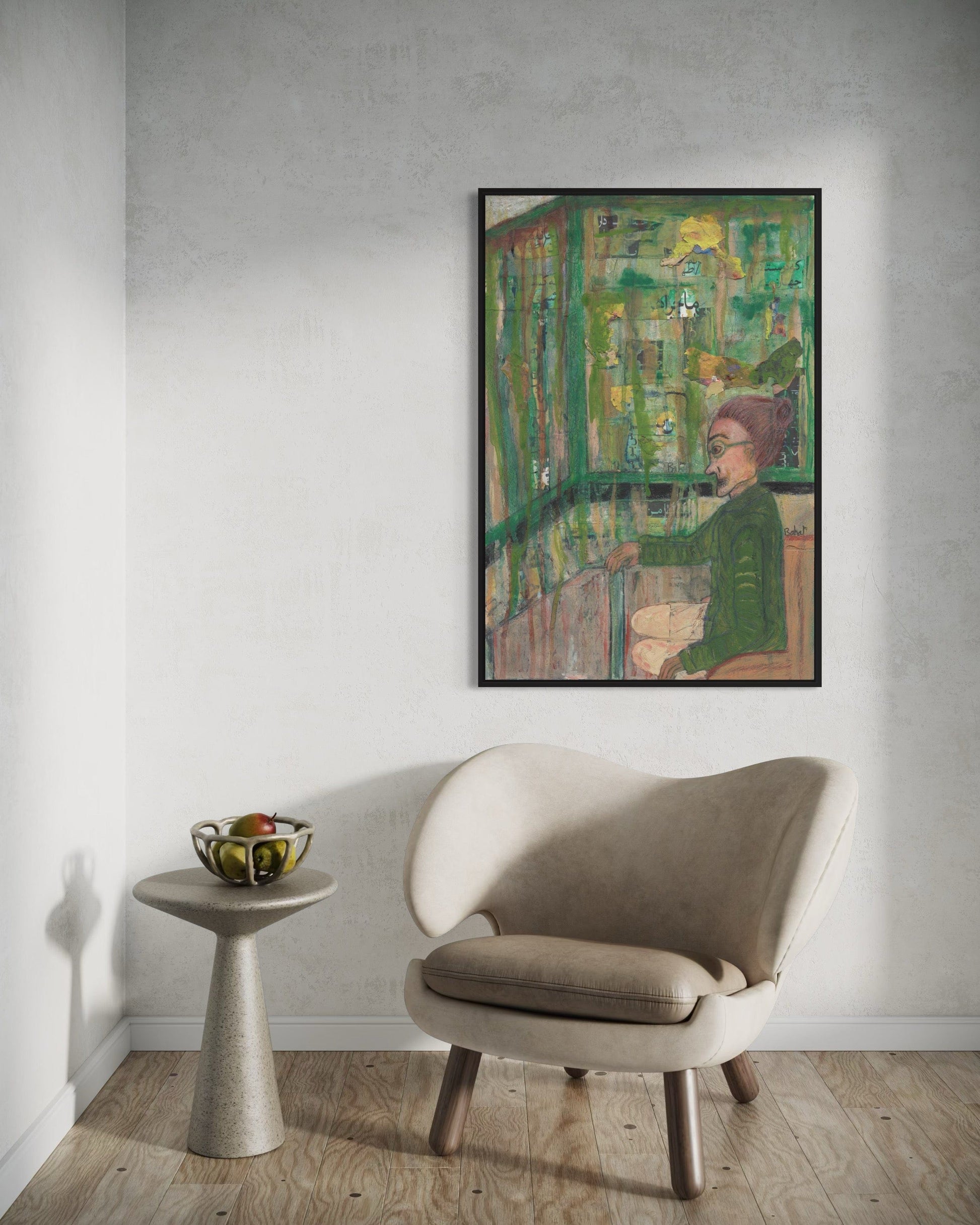 Framed abstract painting on a wall above a beige armchair and small table.
