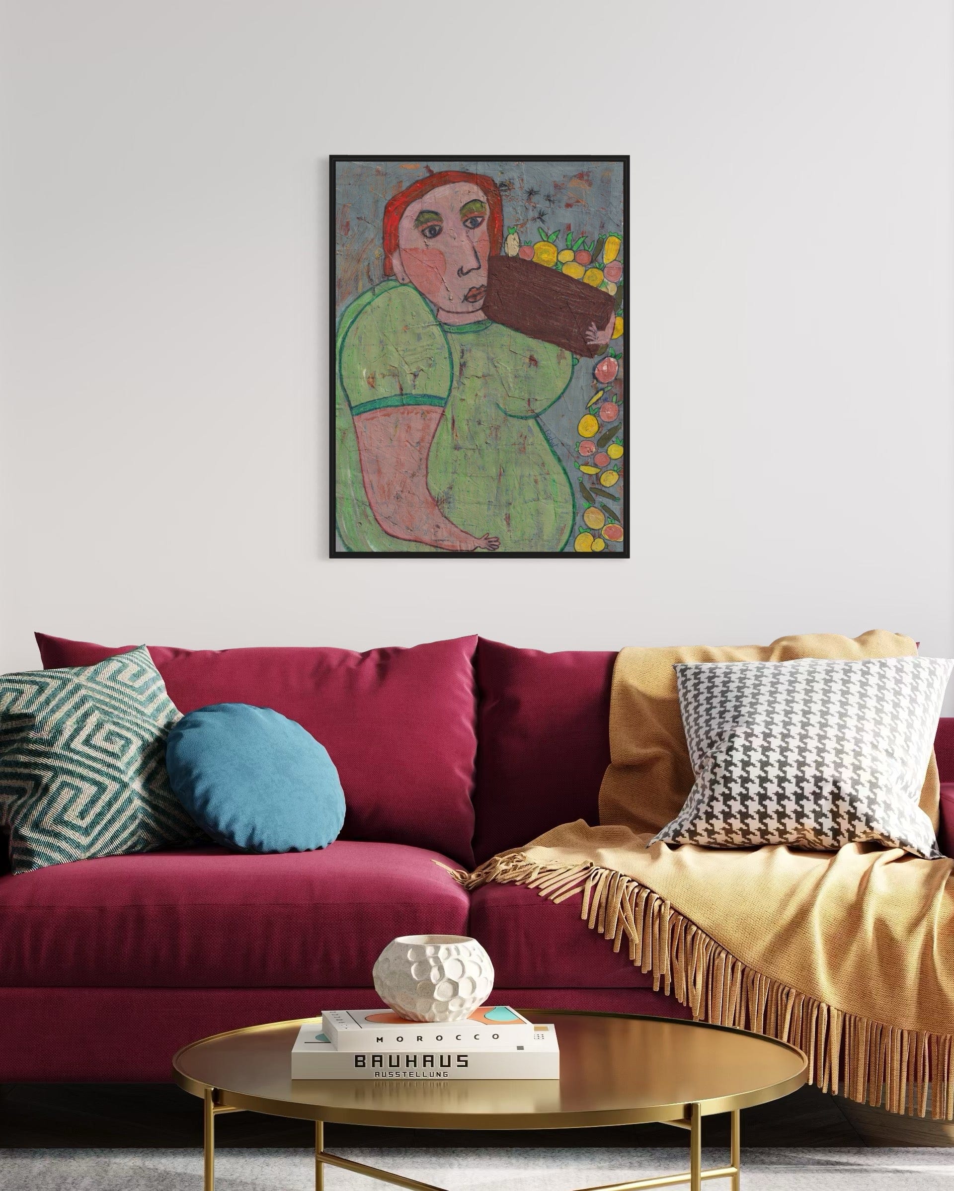 Living room with a colorful sofa, coffee table, and framed artwork on the wall.