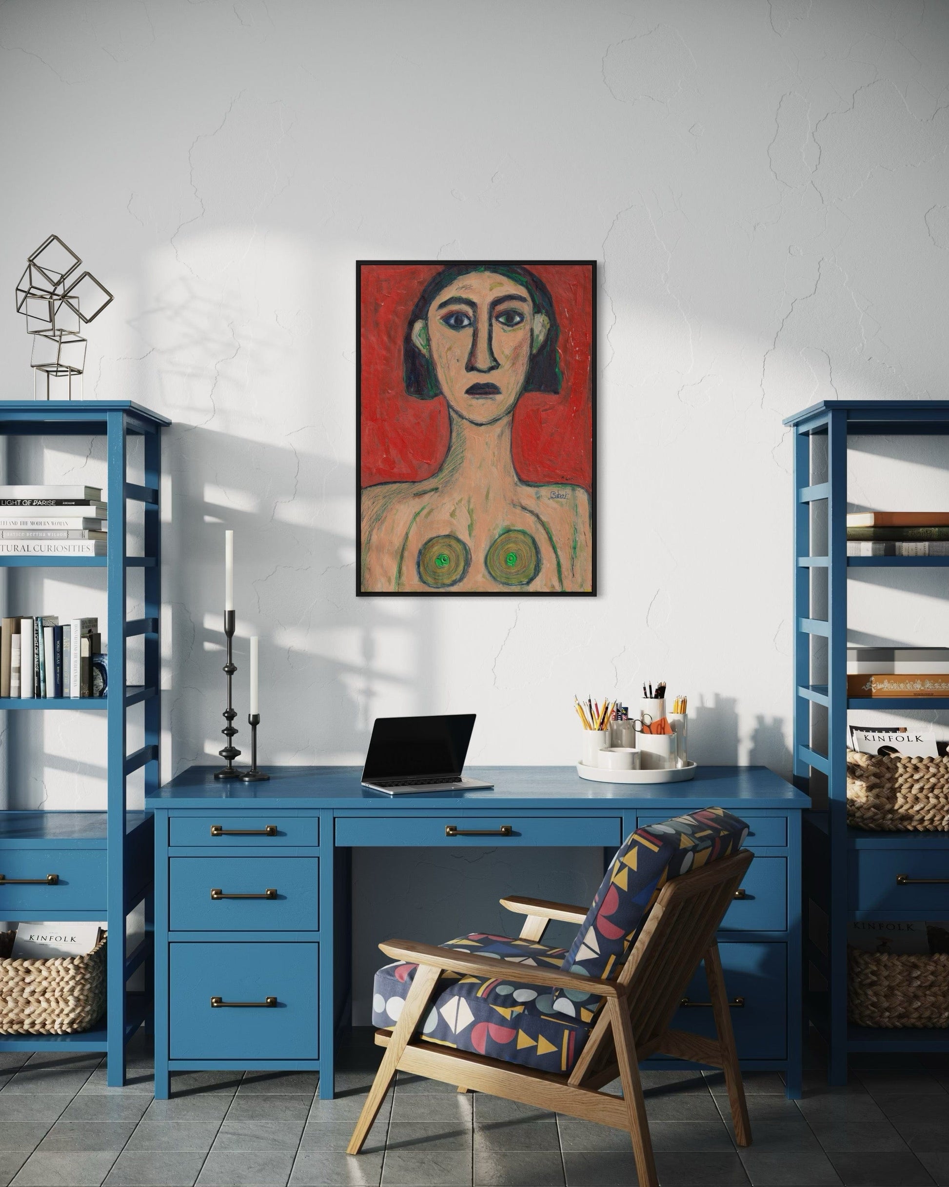 Home office with blue desk, chair, and bookshelves, featuring a painting on the wall.
