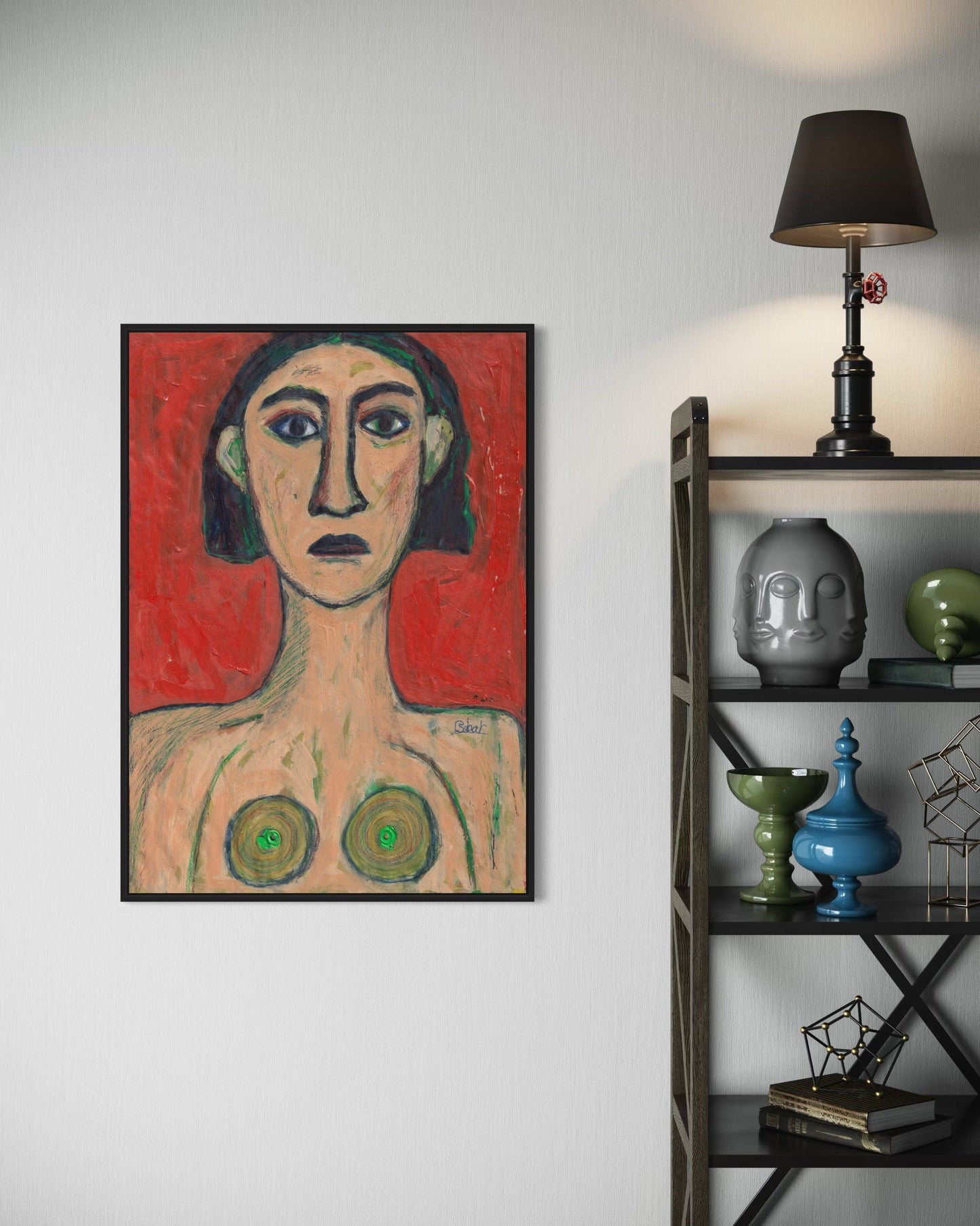 Framed artwork on a wall next to a shelf with decorative items