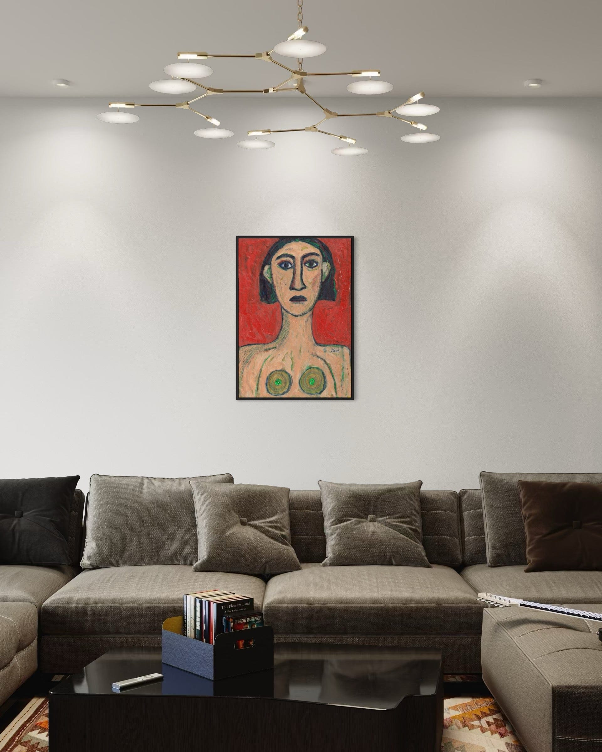 Modern living room with a gray sectional sofa, coffee table, and a colorful painting on the wall.