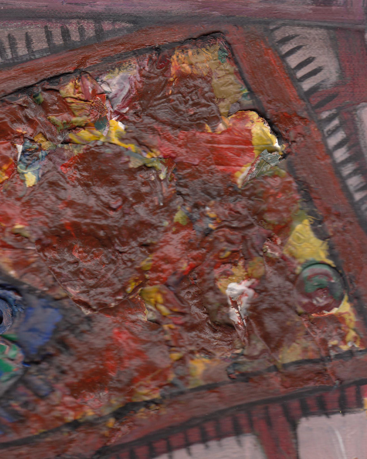 Close-up of a textured surface with red, brown, and yellow colors