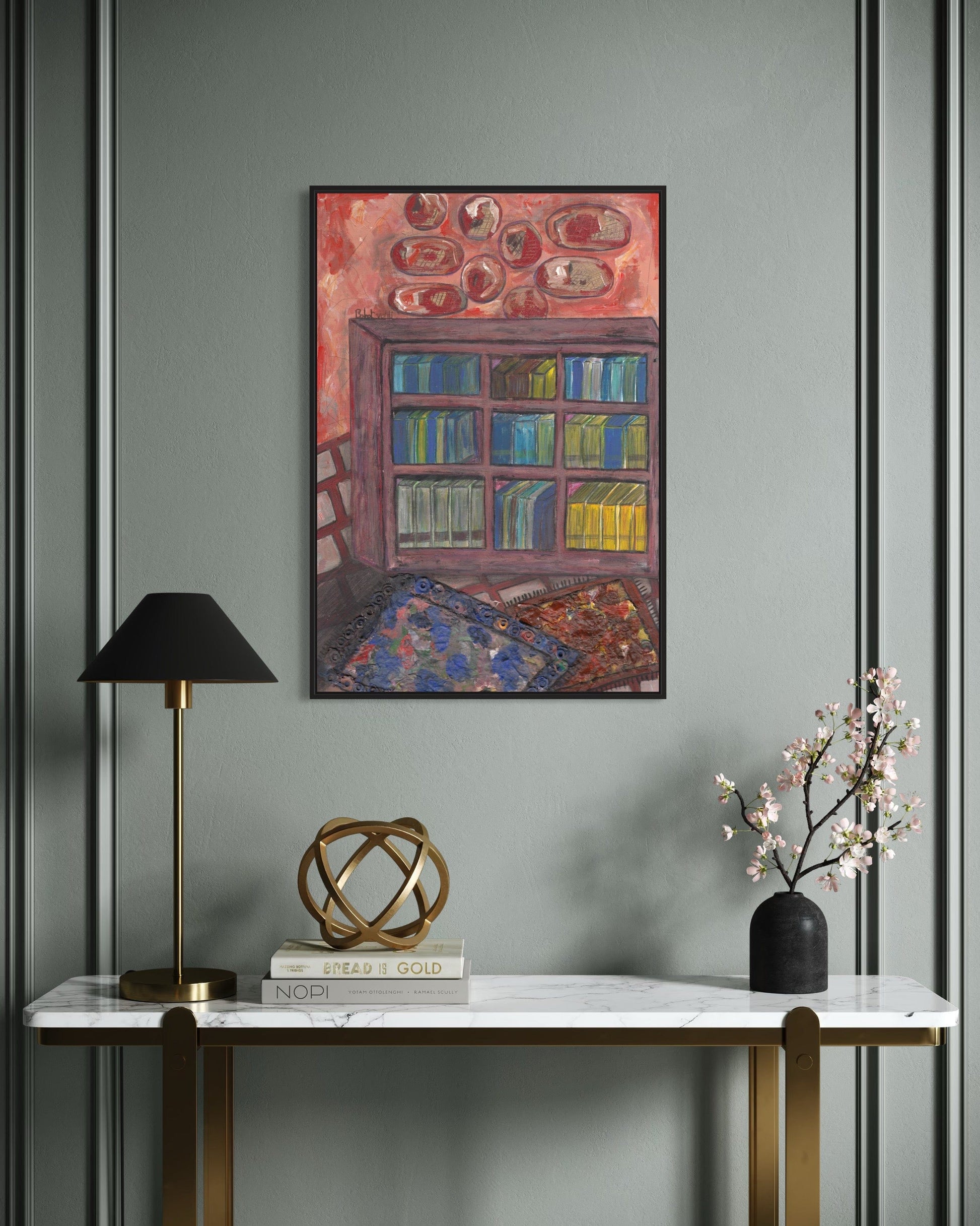 Decorative interior with a painting of a bookshelf, lamp, sculpture, and vase on a marble table against a gray wall.