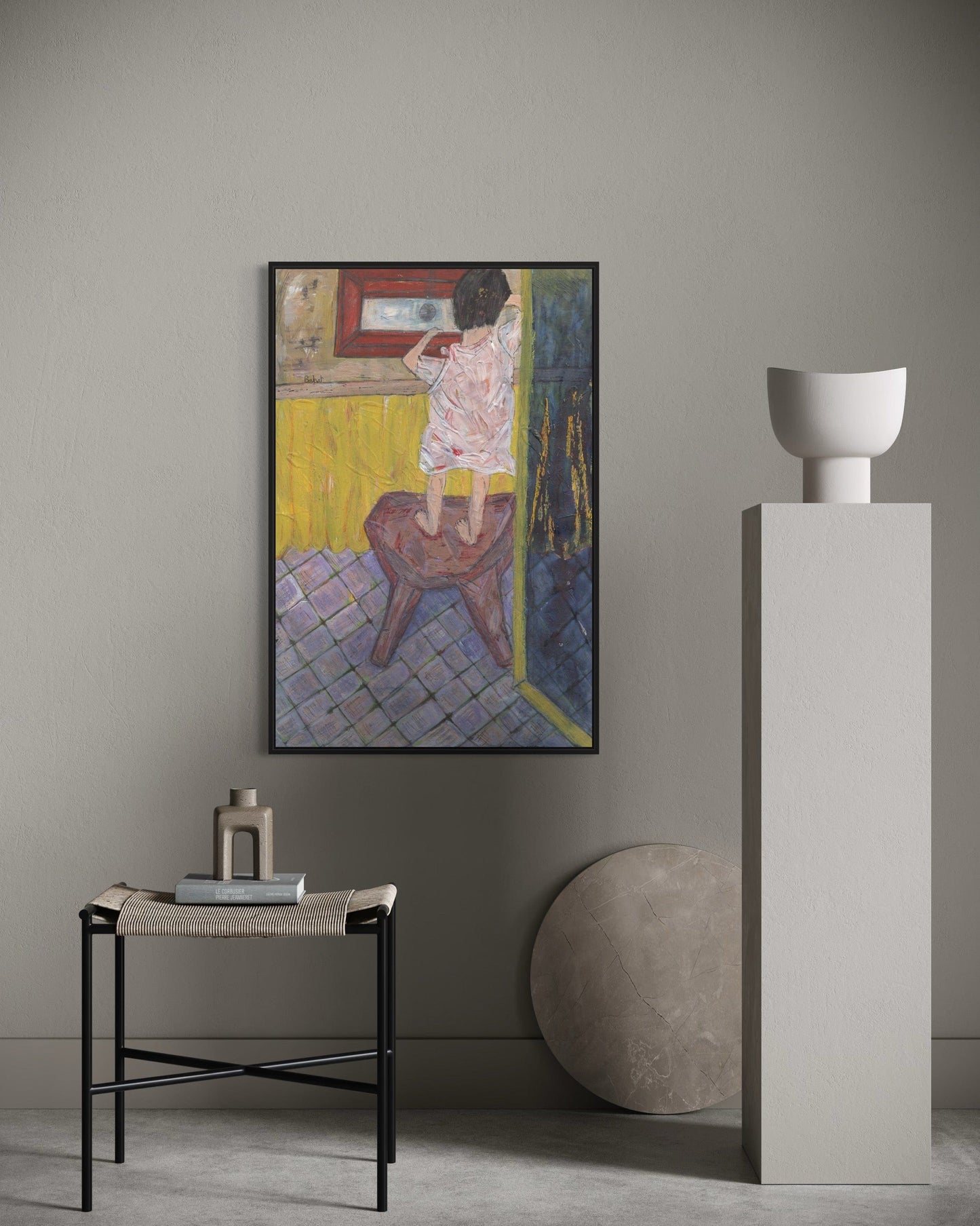 Artistic interior setting with a framed painting, side table, and sculpture against a neutral wall.