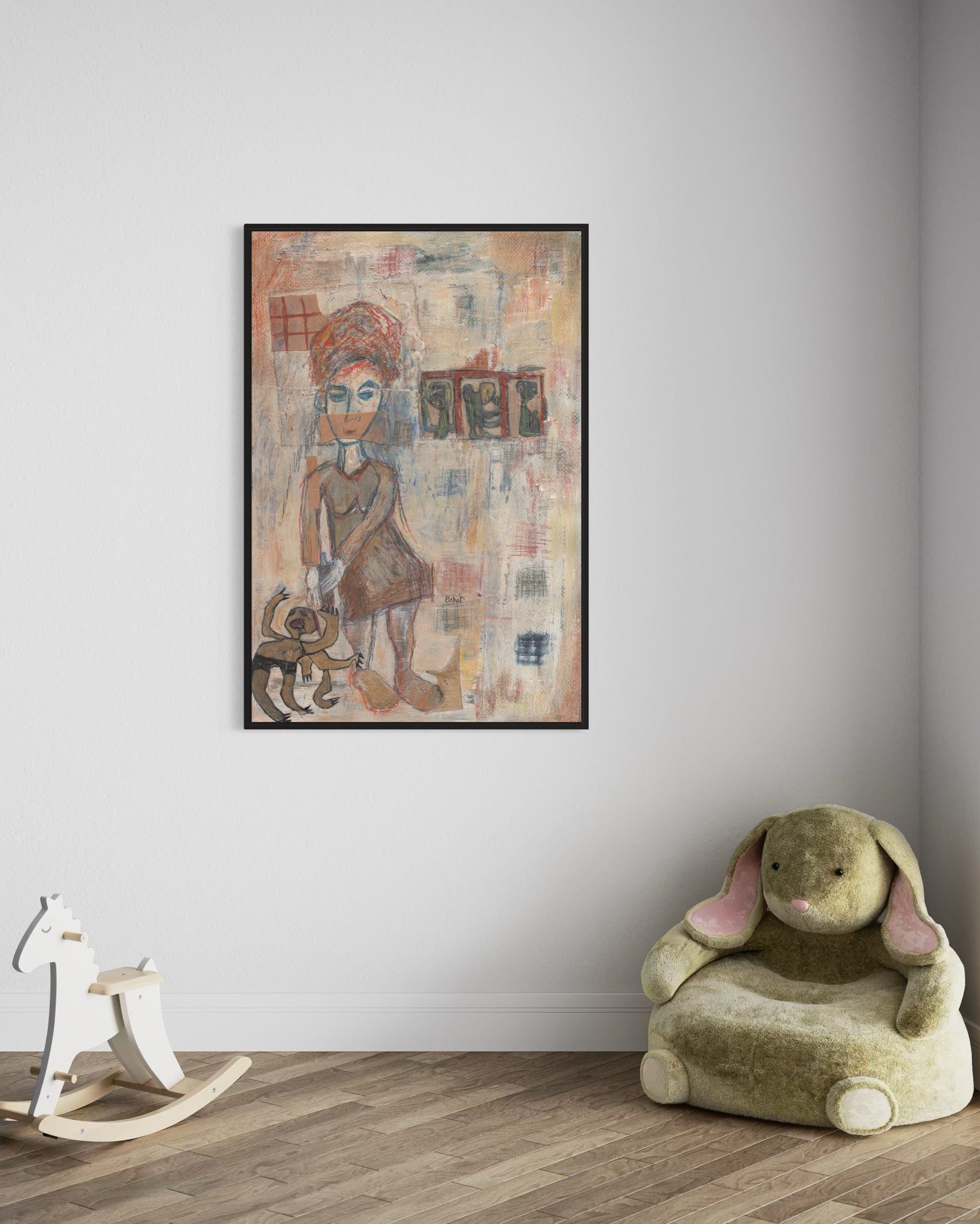 Framed abstract artwork on a wall with a child's chair and rocking horse below.