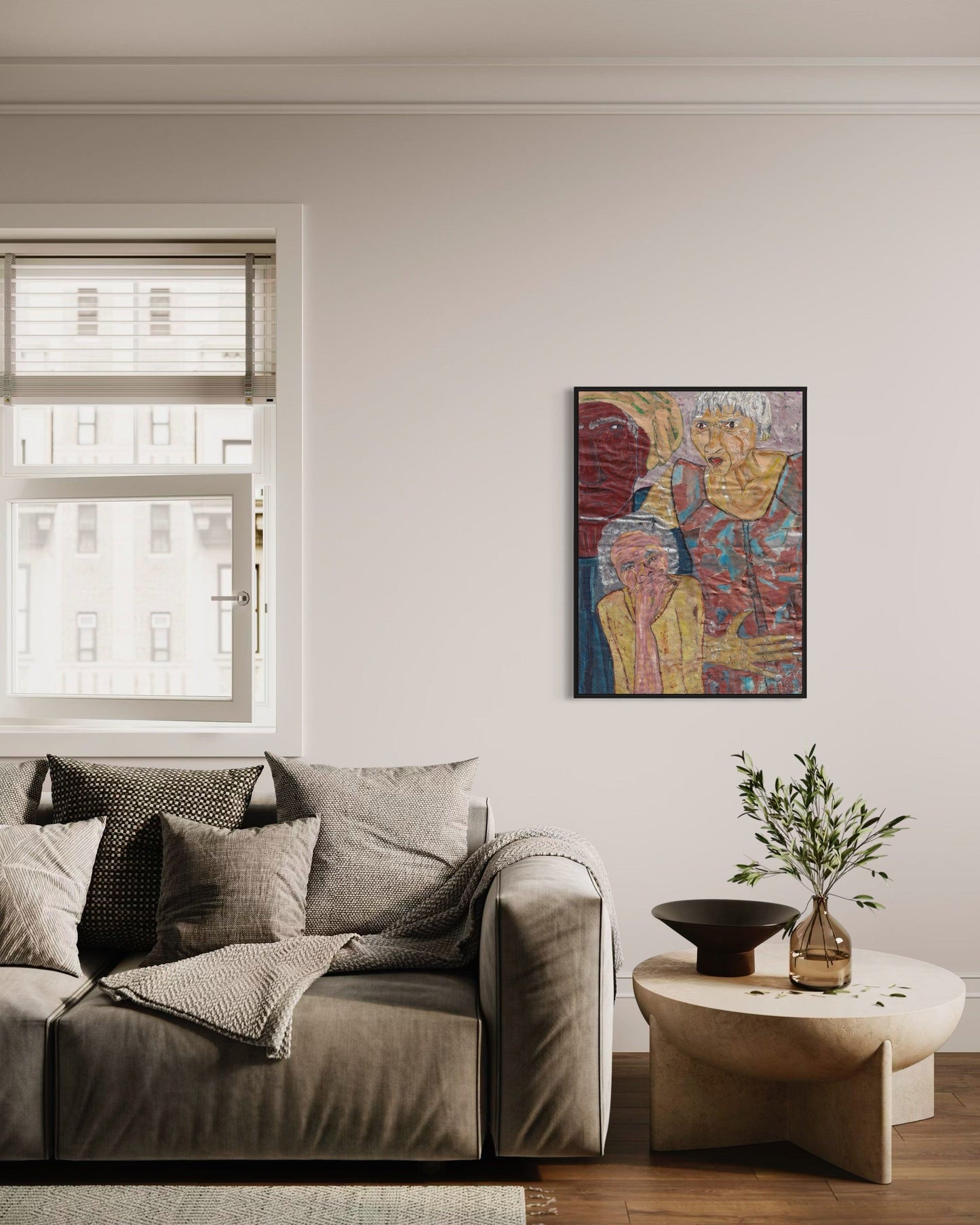 Living room with a gray sofa, colorful abstract painting, and small table with decorative items.