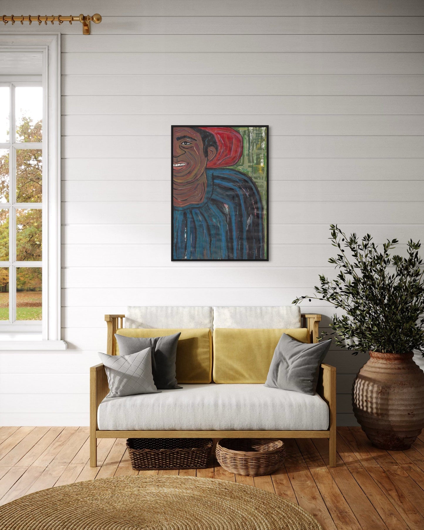 Living room with a yellow sofa, decorative pillows, and a wall painting.