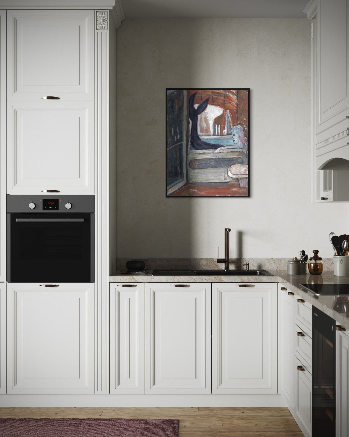 Modern kitchen with white cabinets, black appliances, and a painting on the wall.