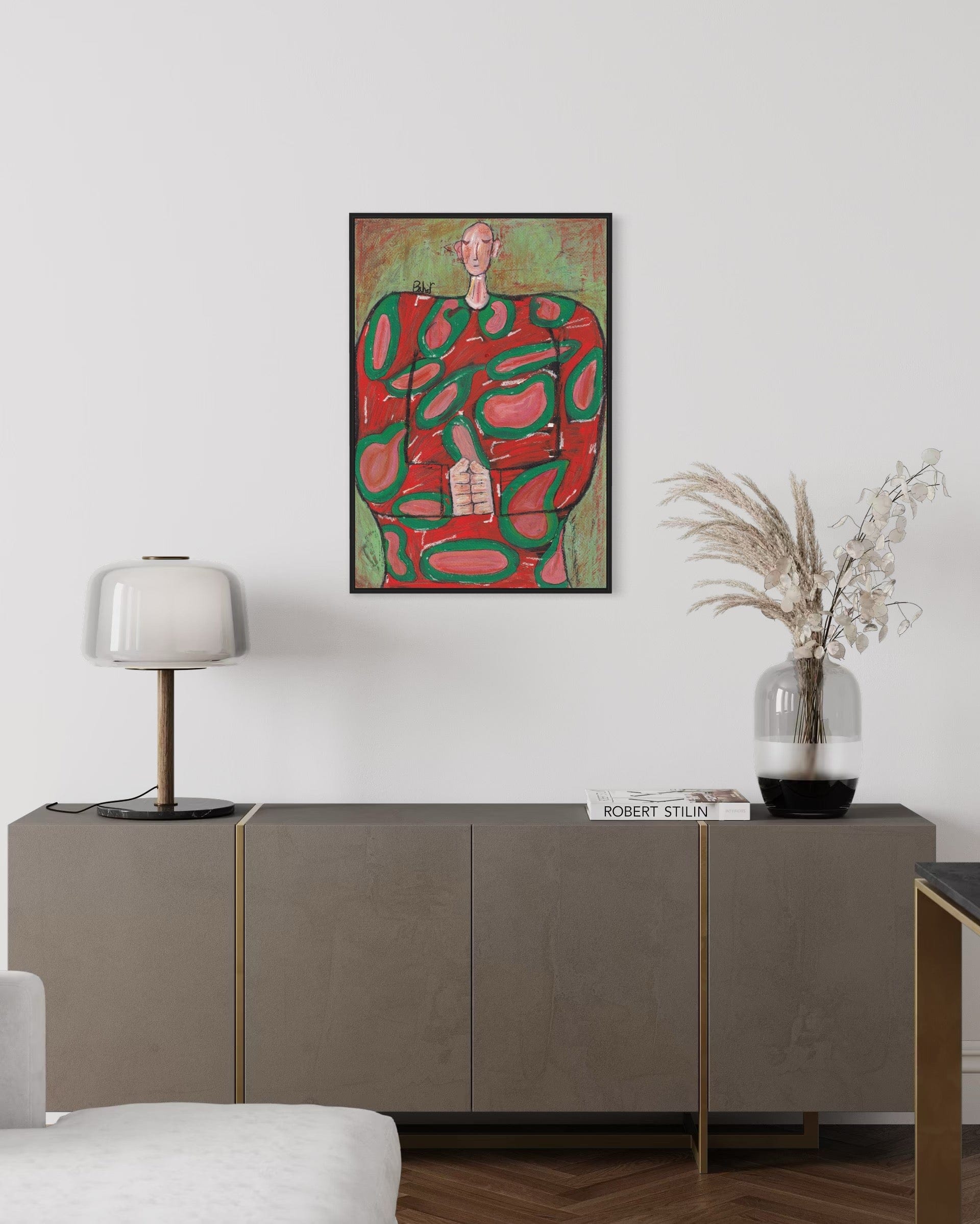 Abstract painting in a modern living room setting with a sideboard and decor items.