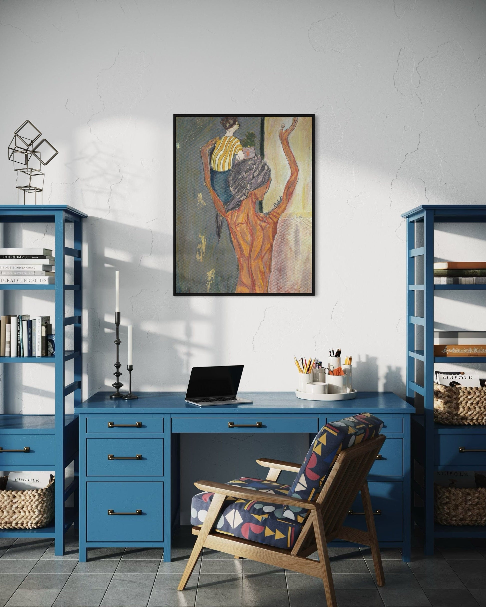 Home office with blue desk, chair, and bookshelves, featuring a painting on the wall.