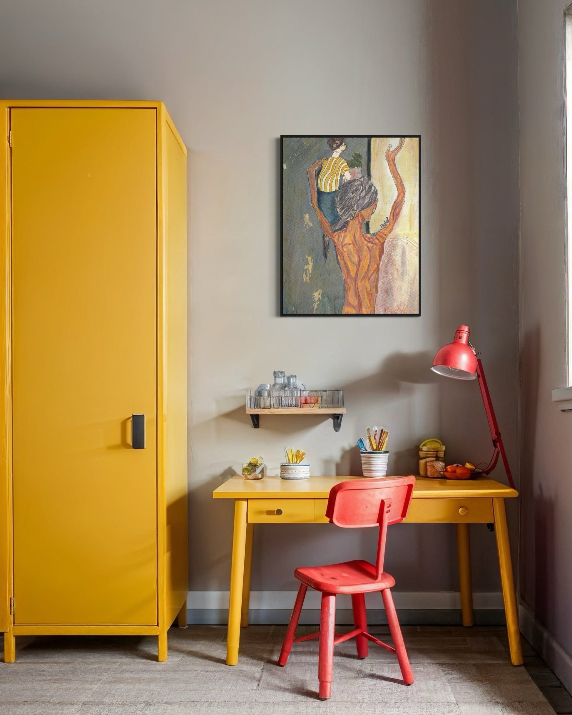 Yellow cabinet, red chair, and desk with a painting on the wall in a room.