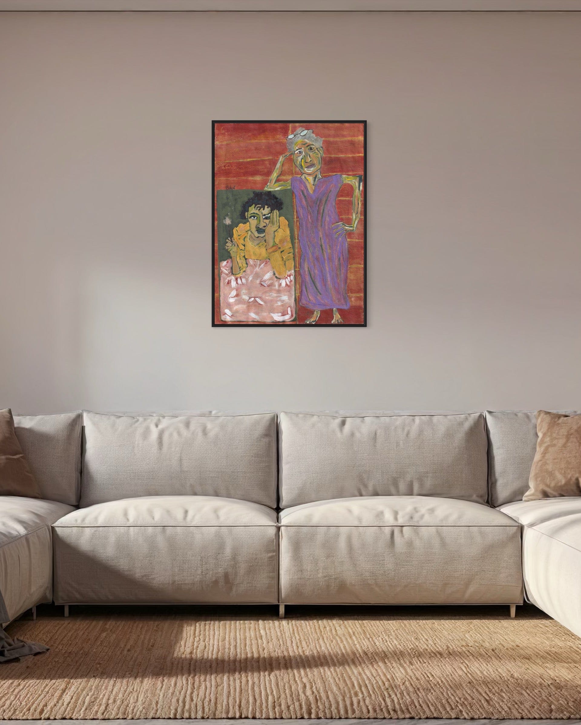 Framed artwork on a wall above a beige sectional sofa.