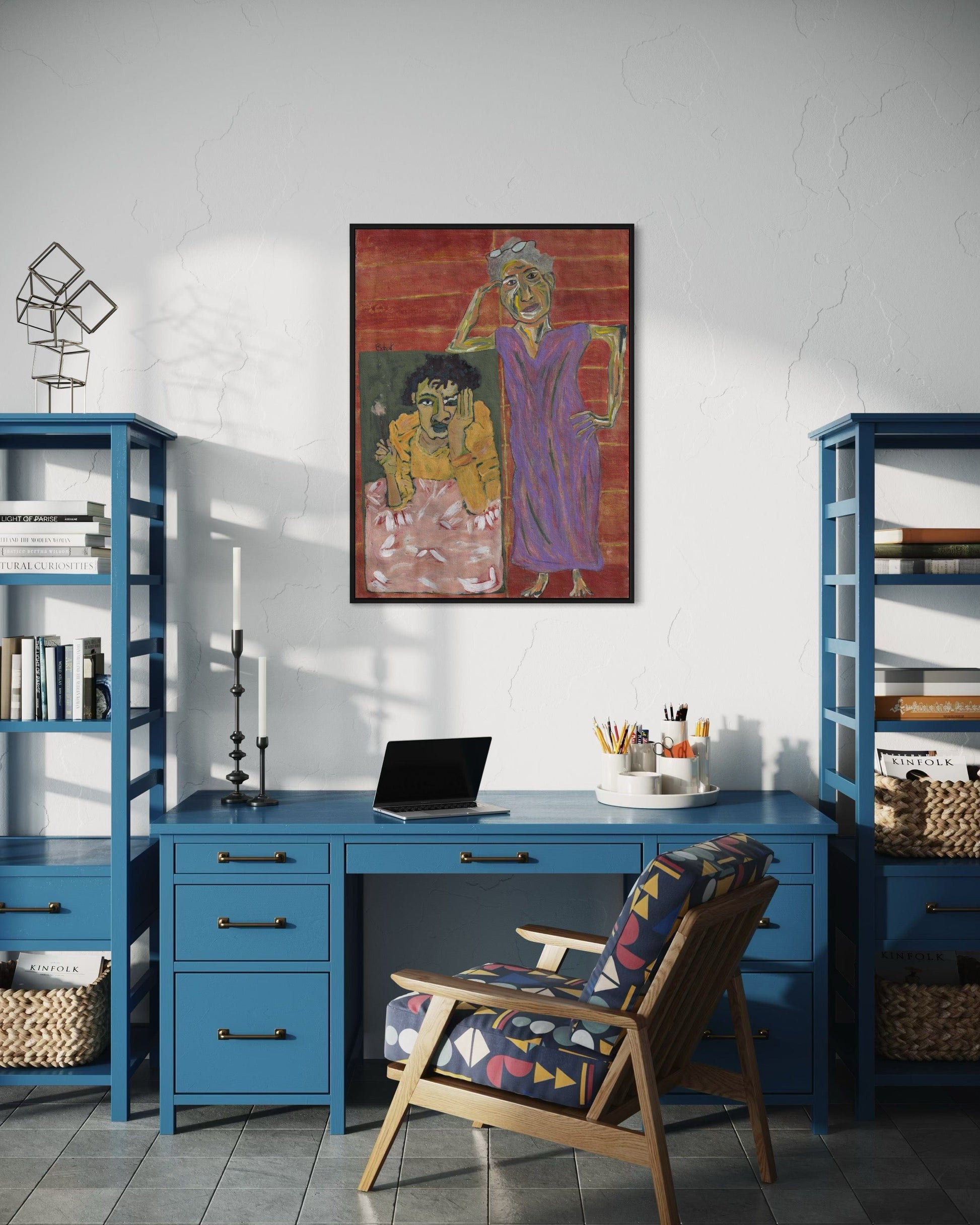 Home office with blue desk, chair, and bookshelves, featuring a colorful painting on the wall.