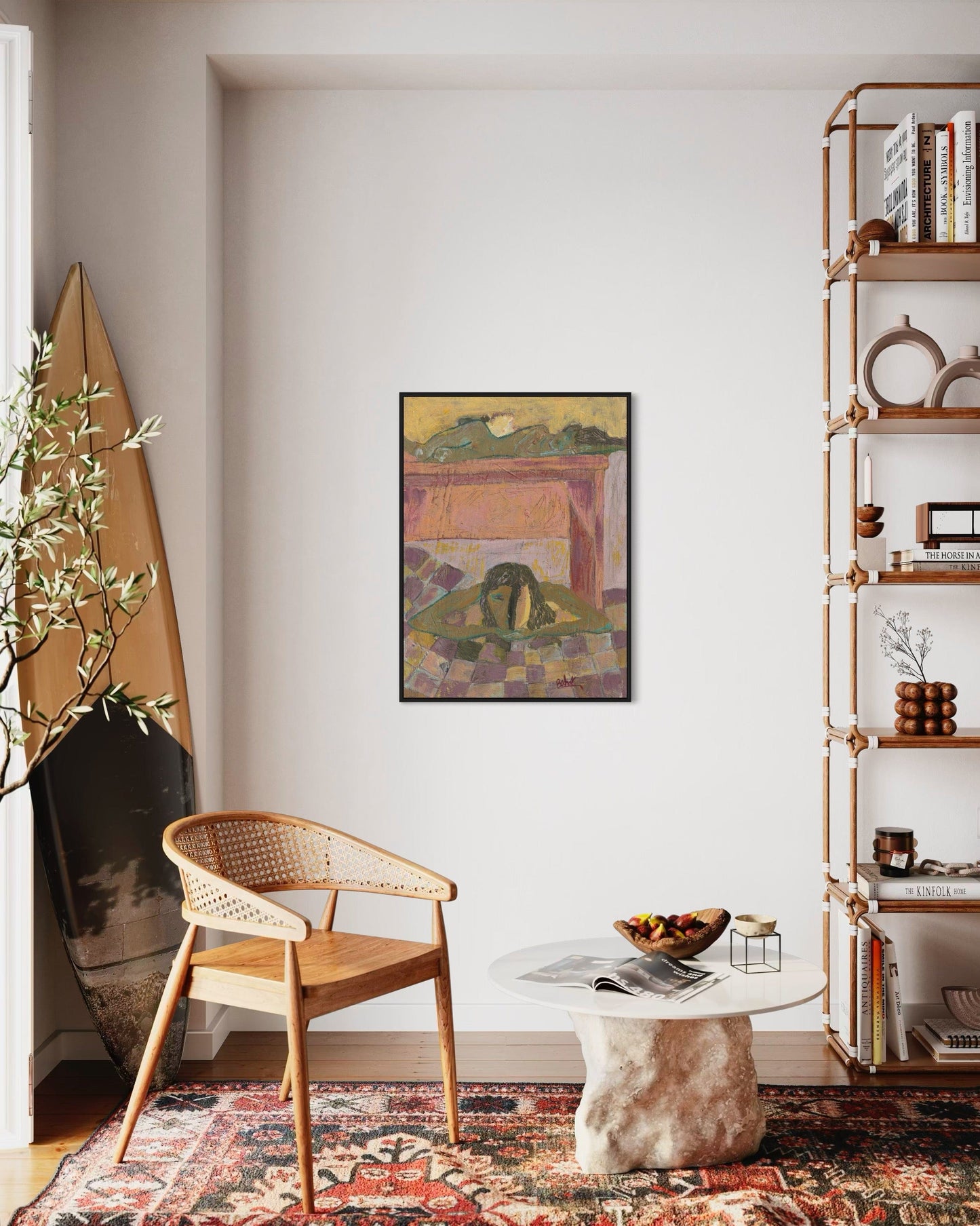 Living room with a wooden chair, round table, and bookshelf.