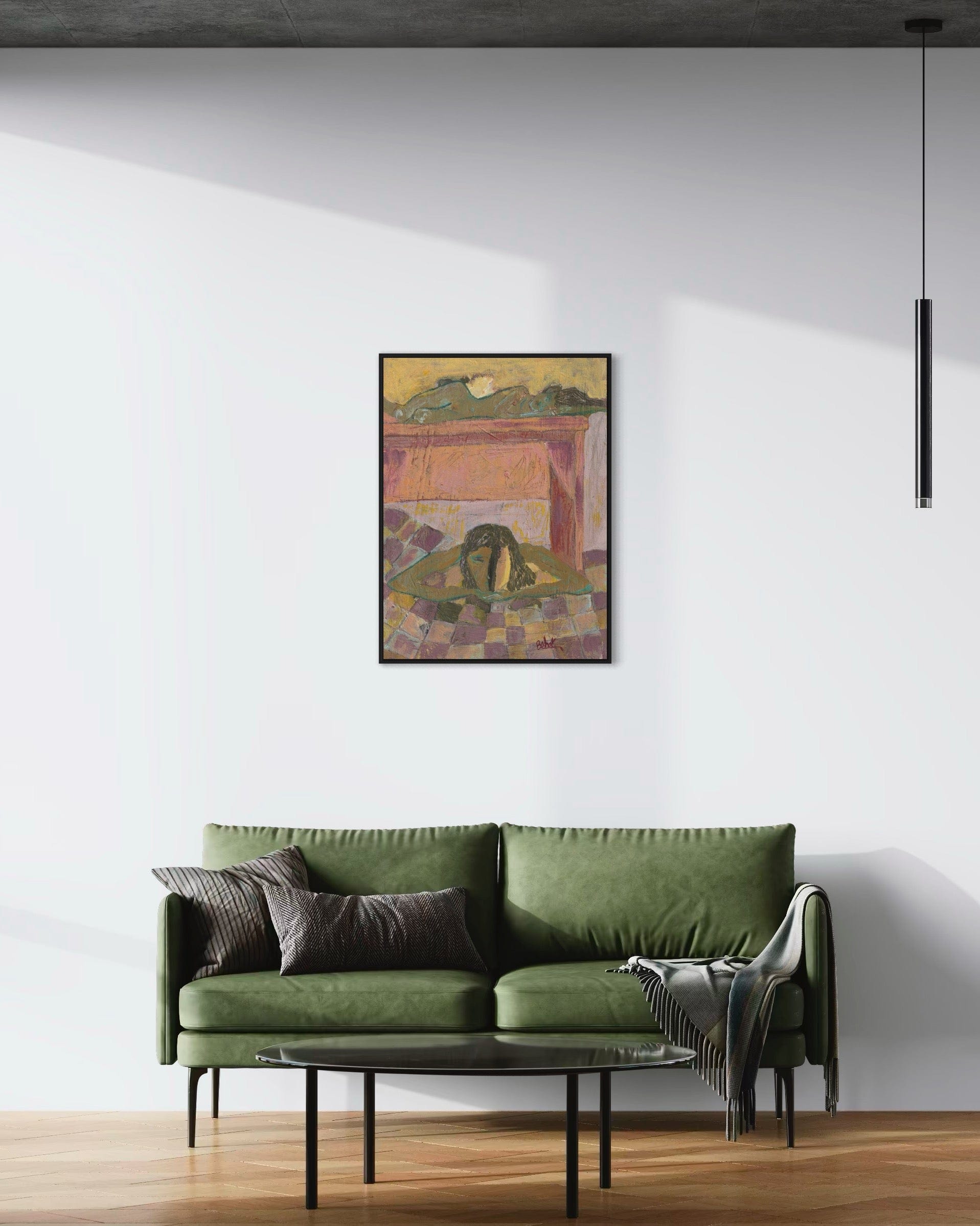 Green sofa in a living room with a colorful abstract painting on the wall.