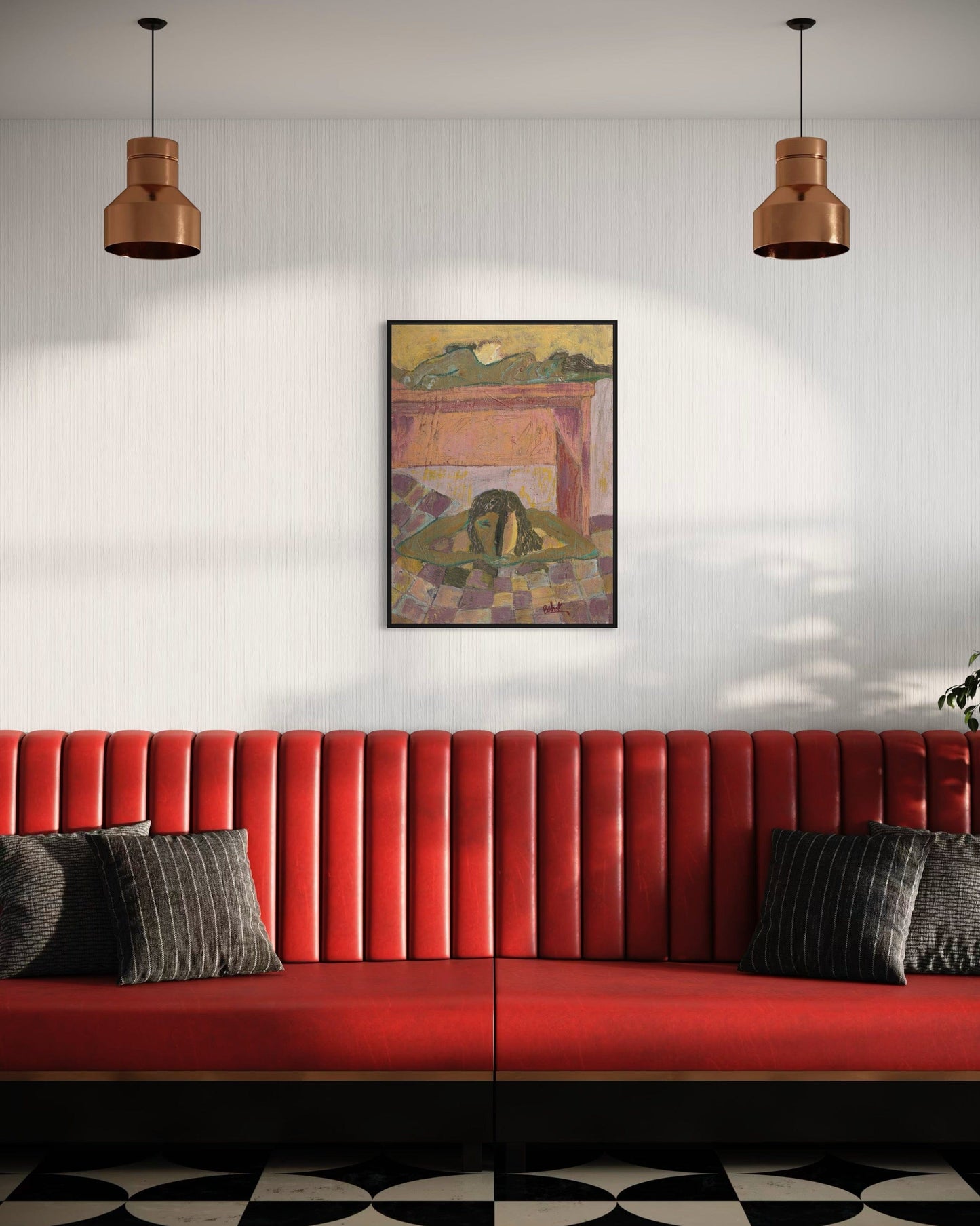 Red sofa with gray cushions in a room with a painting on the wall and two hanging lights.