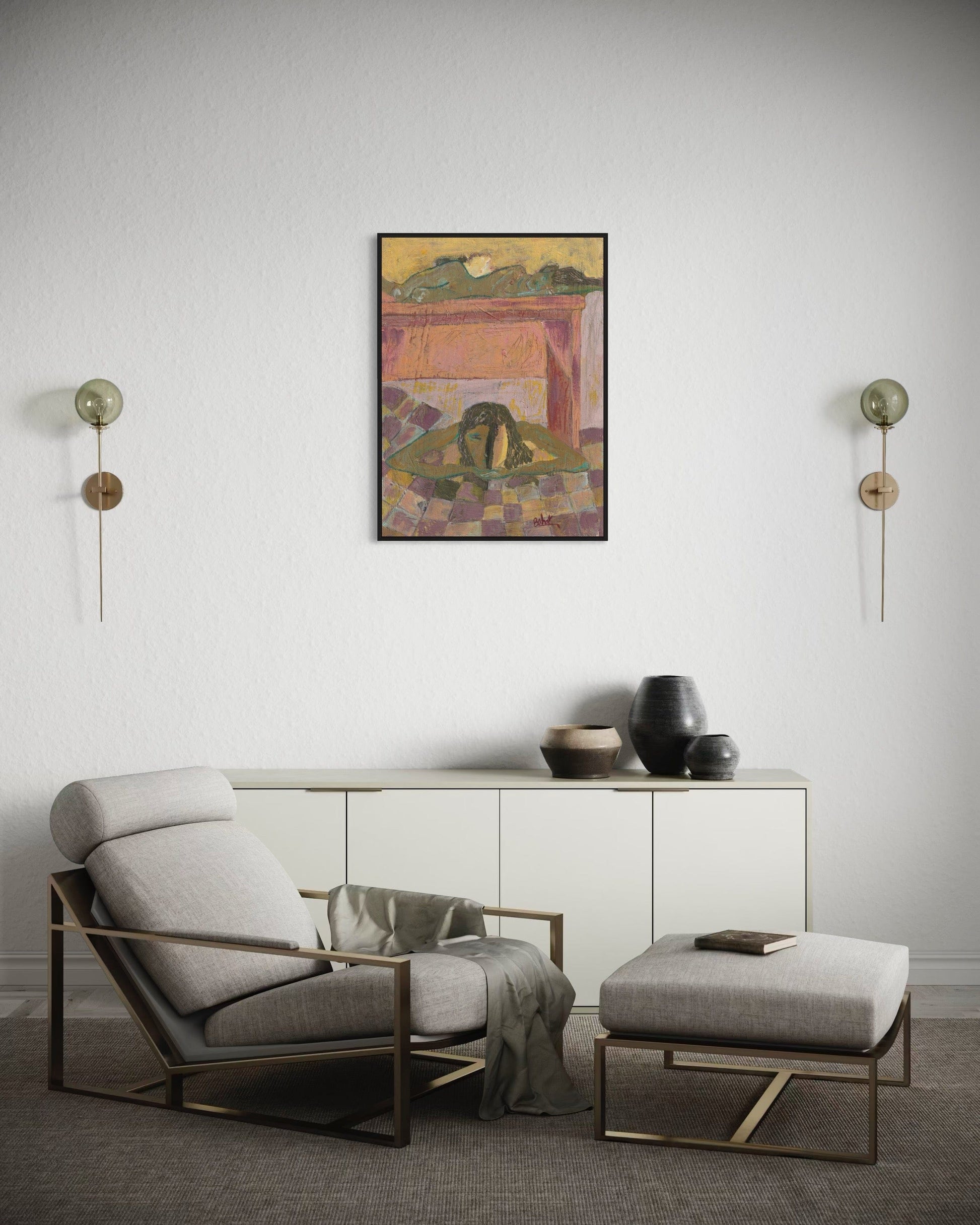 Modern living room with a gray armchair, ottoman, and sideboard against a white wall with a colorful abstract painting.