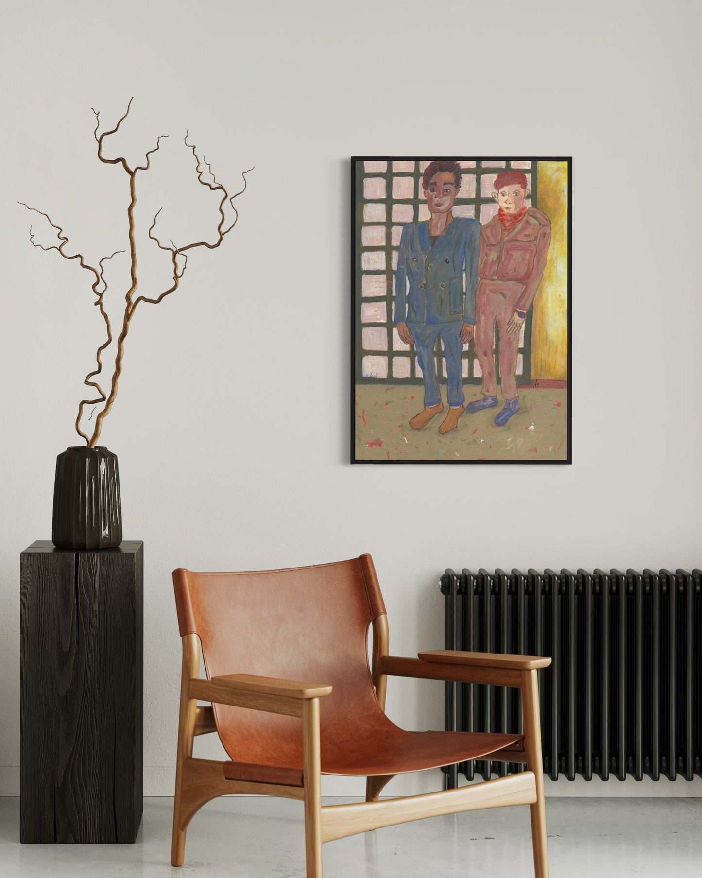 Modern interior with a brown leather chair, vase with branches, and framed artwork on the wall.