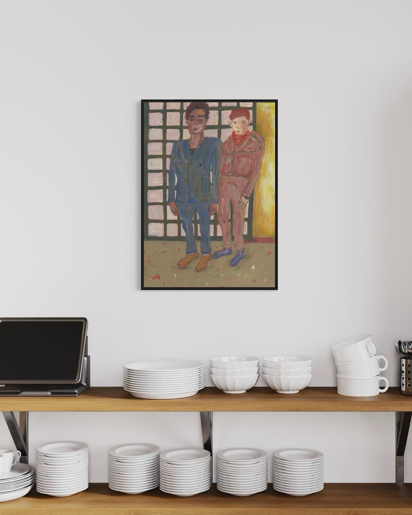 Framed artwork of two figures on a wall above a shelf with kitchenware.
