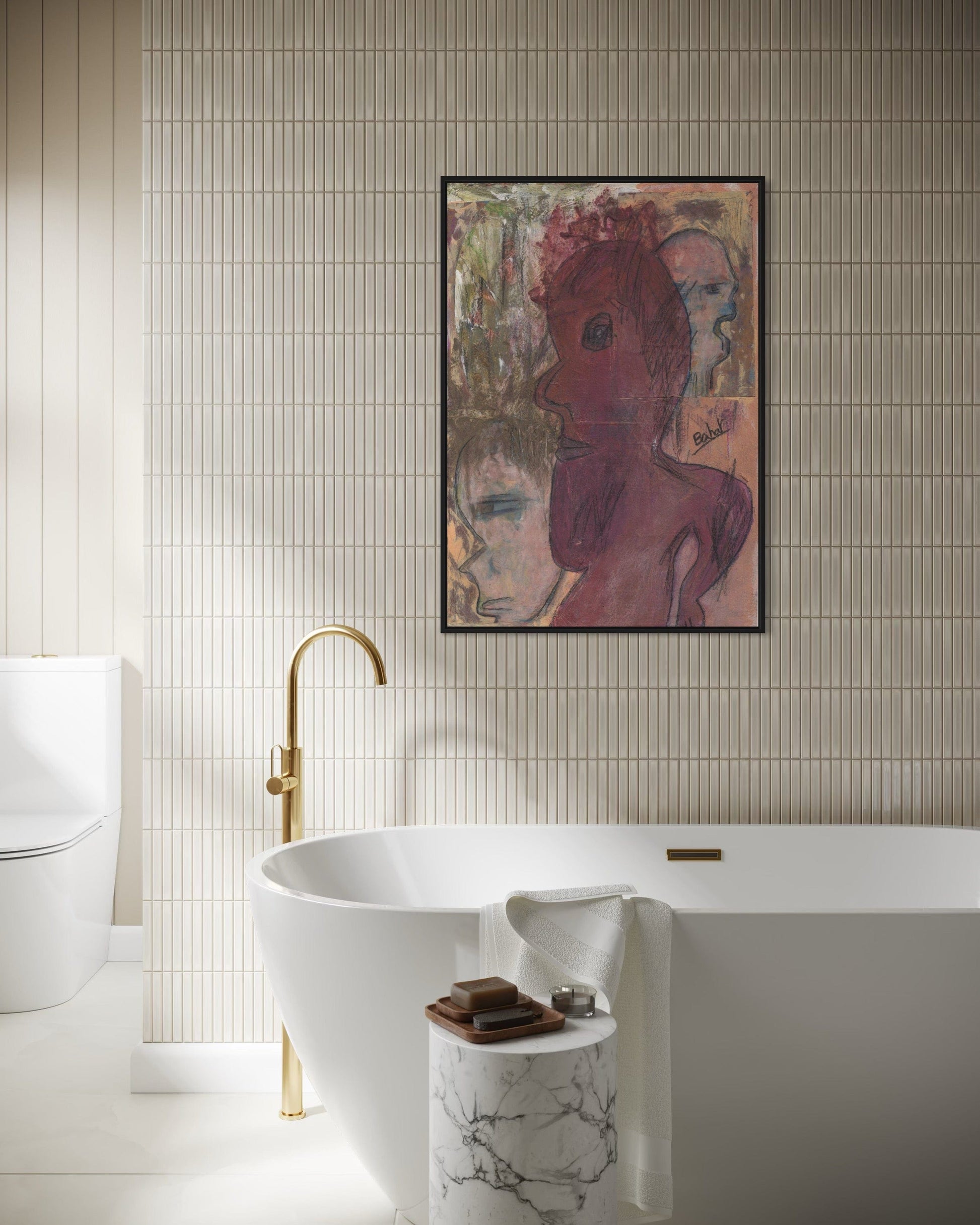 Bathroom with a freestanding bathtub, gold faucet, and abstract art on the wall.
