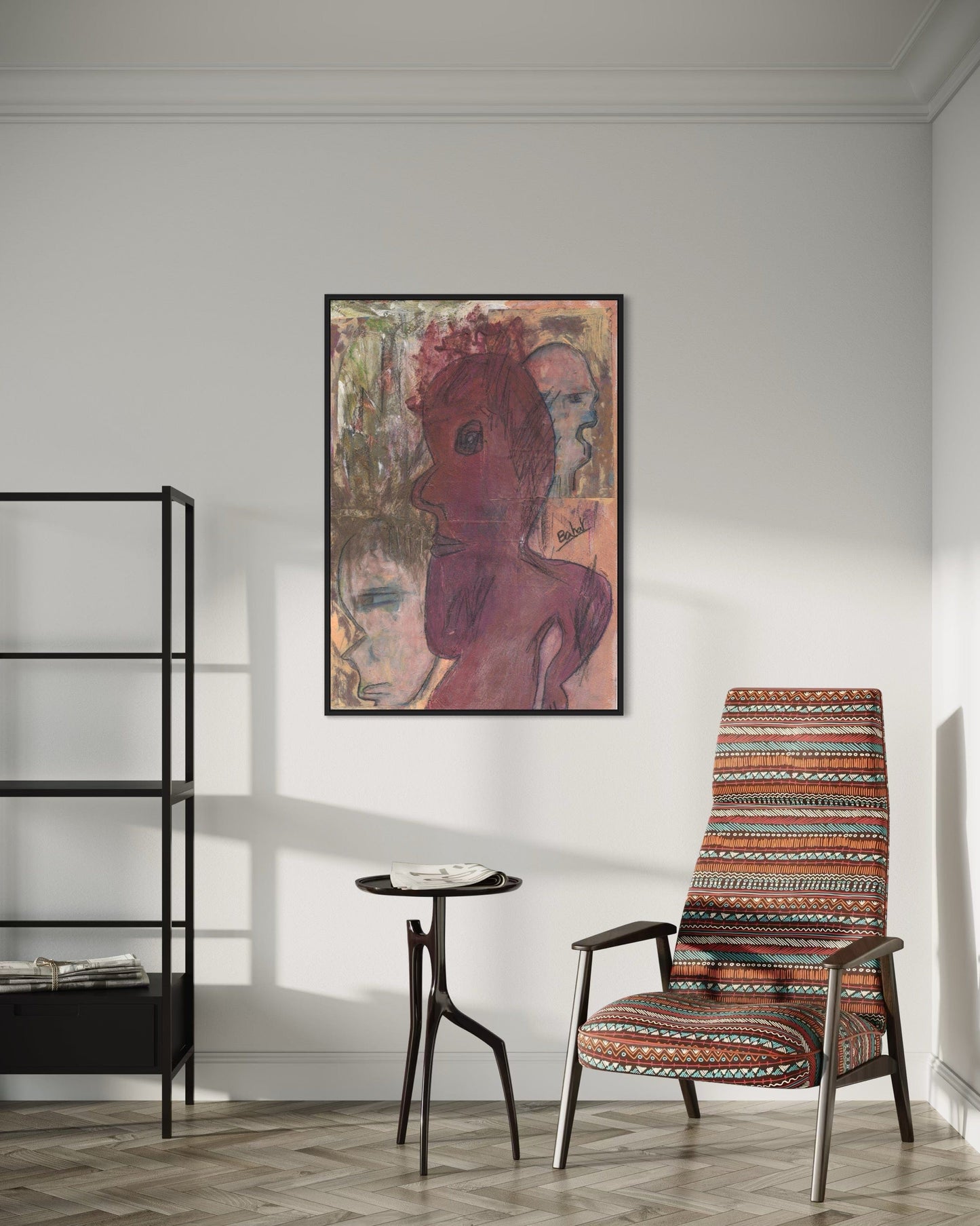 Patterned armchair in a room with a framed artwork on the wall.